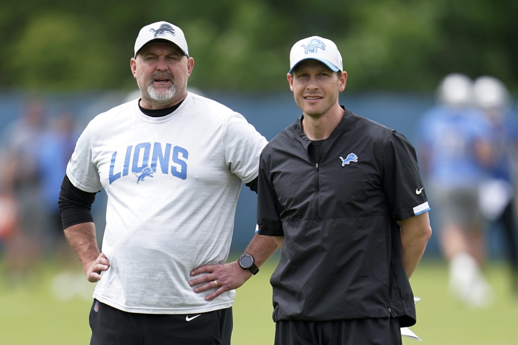 Detroit Lions senior offensive assistant John Morton, left, and offensive coordinator Ben Johnson watch during an NFL football practice in Allen Park, Mich., Thursday, May 26, 2022. (AP Photo/Paul Sancya)