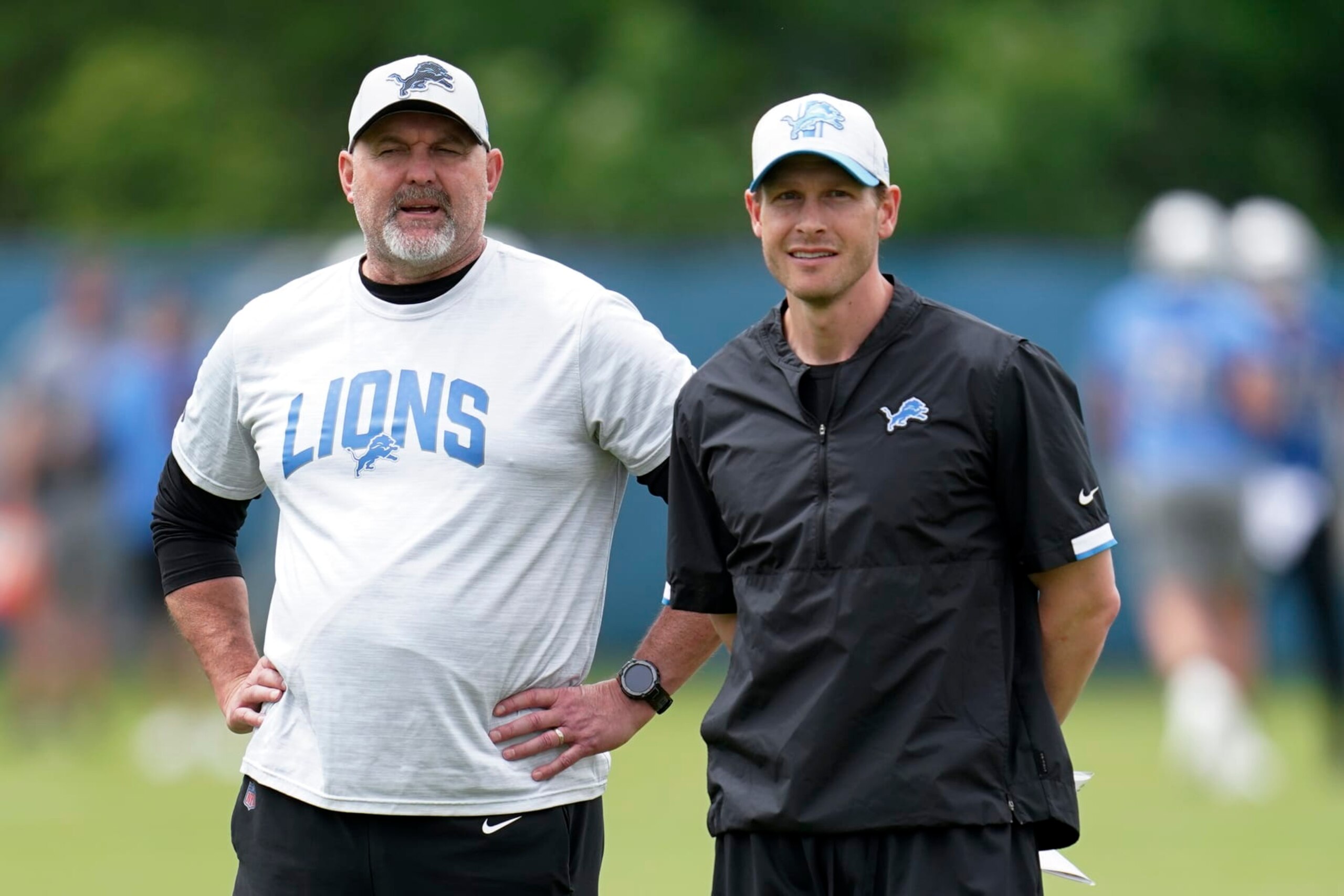 Detroit Lions senior offensive assistant John Morton, left, and offensive coordinator Ben Johnson watch during an NFL football practice in Allen Park, Mich., Thursday, May 26, 2022. (AP Photo/Paul Sancya)