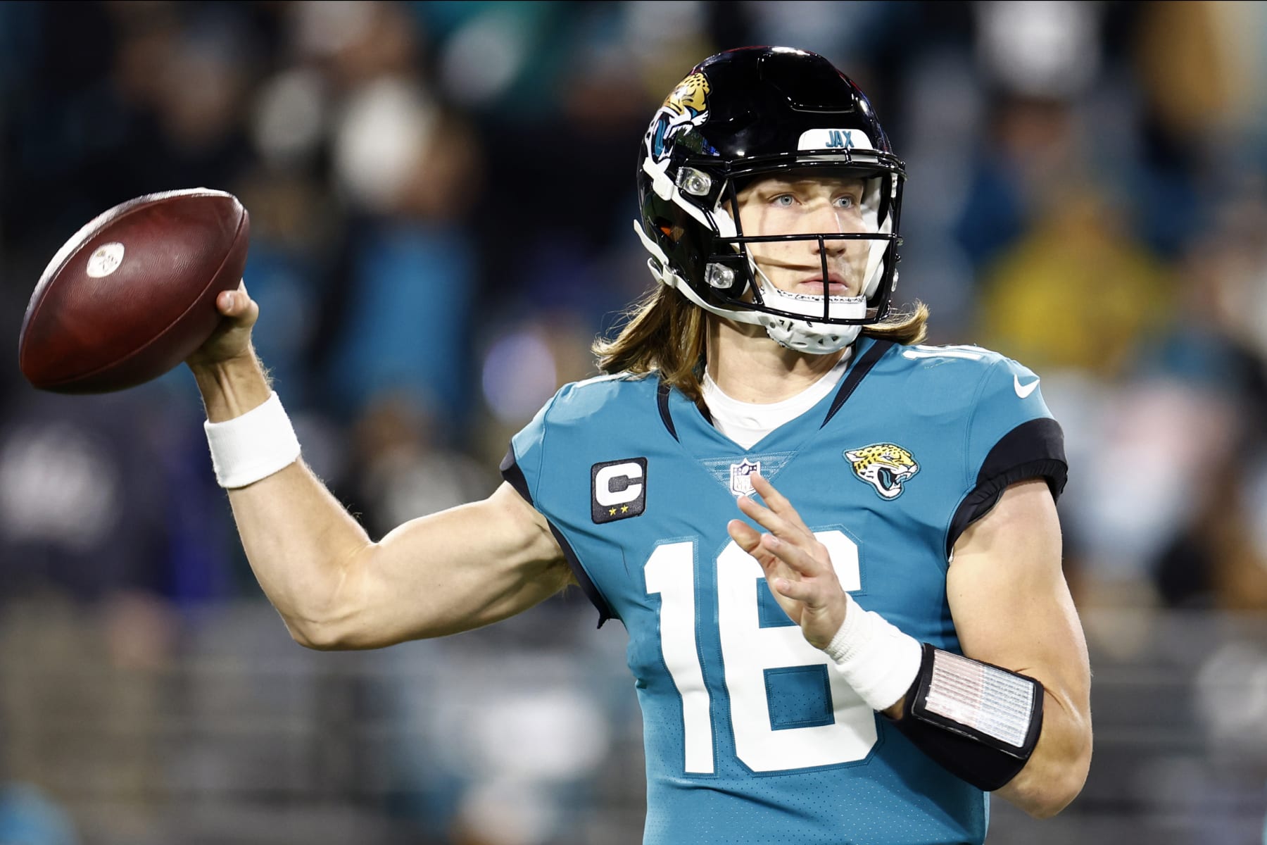 JACKSONVILLE, FLORIDA - JANUARY 14: Trevor Lawrence #16 of the Jacksonville Jaguars throws a pass against the Los Angeles Chargers during the second half of the game in the AFC Wild Card playoff game at TIAA Bank Field on January 14, 2023 in Jacksonville, Florida. (Photo by Douglas P. DeFelice/Getty Images)