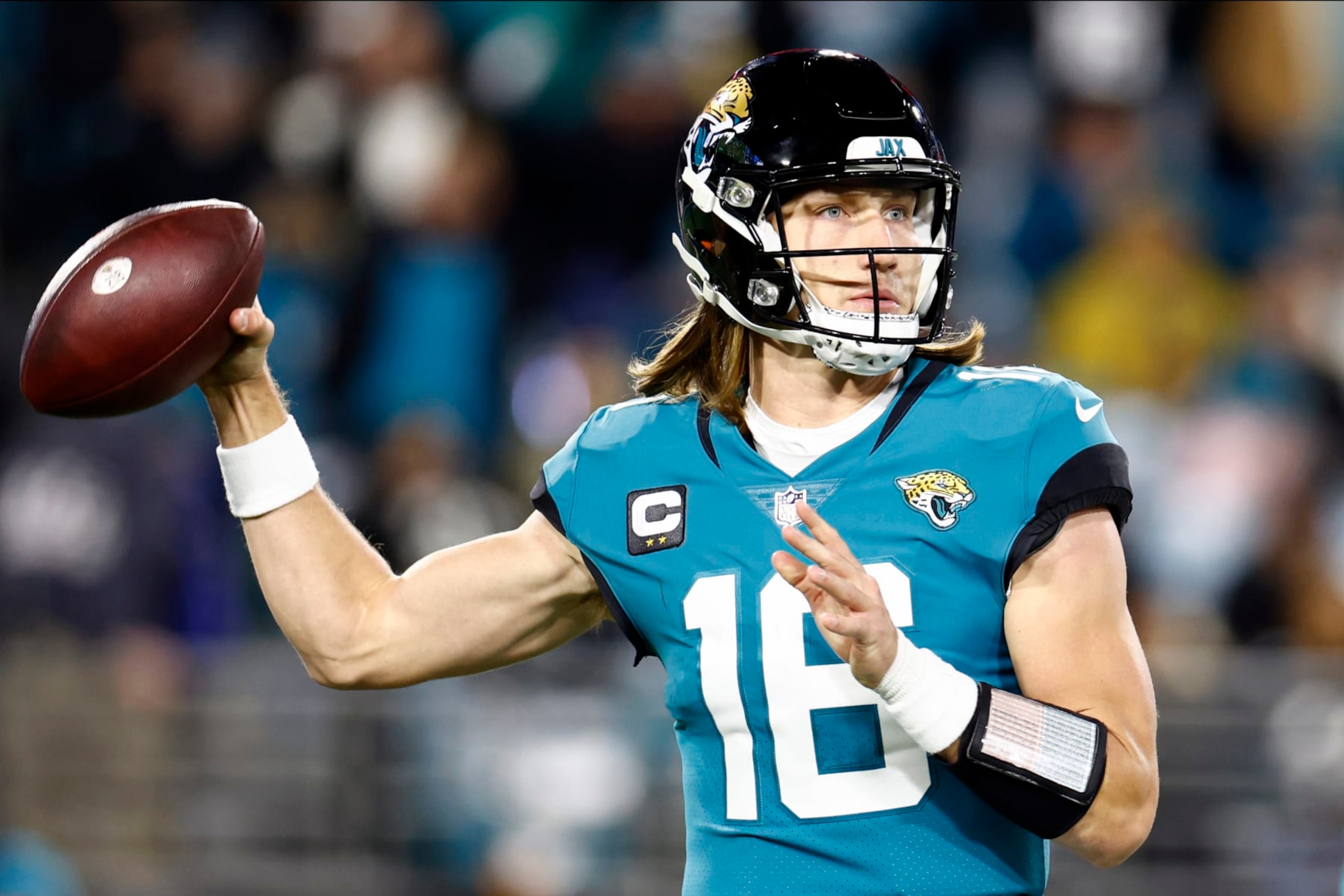 JACKSONVILLE, FLORIDA - JANUARY 14: Trevor Lawrence #16 of the Jacksonville Jaguars throws a pass against the Los Angeles Chargers during the second half of the game in the AFC Wild Card playoff game at TIAA Bank Field on January 14, 2023 in Jacksonville, Florida. (Photo by Douglas P. DeFelice/Getty Images) JACKSONVILLE, FLORIDA - JANUARY 14: Trevor Lawrence #16 of the Jacksonville Jaguars throws a pass against the Los Angeles Chargers during the second half of the game in the AFC Wild Card playoff game at TIAA Bank Field on January 14, 2023 in Jacksonville, Florida. (Photo by Douglas P. DeFelice/Getty Images)