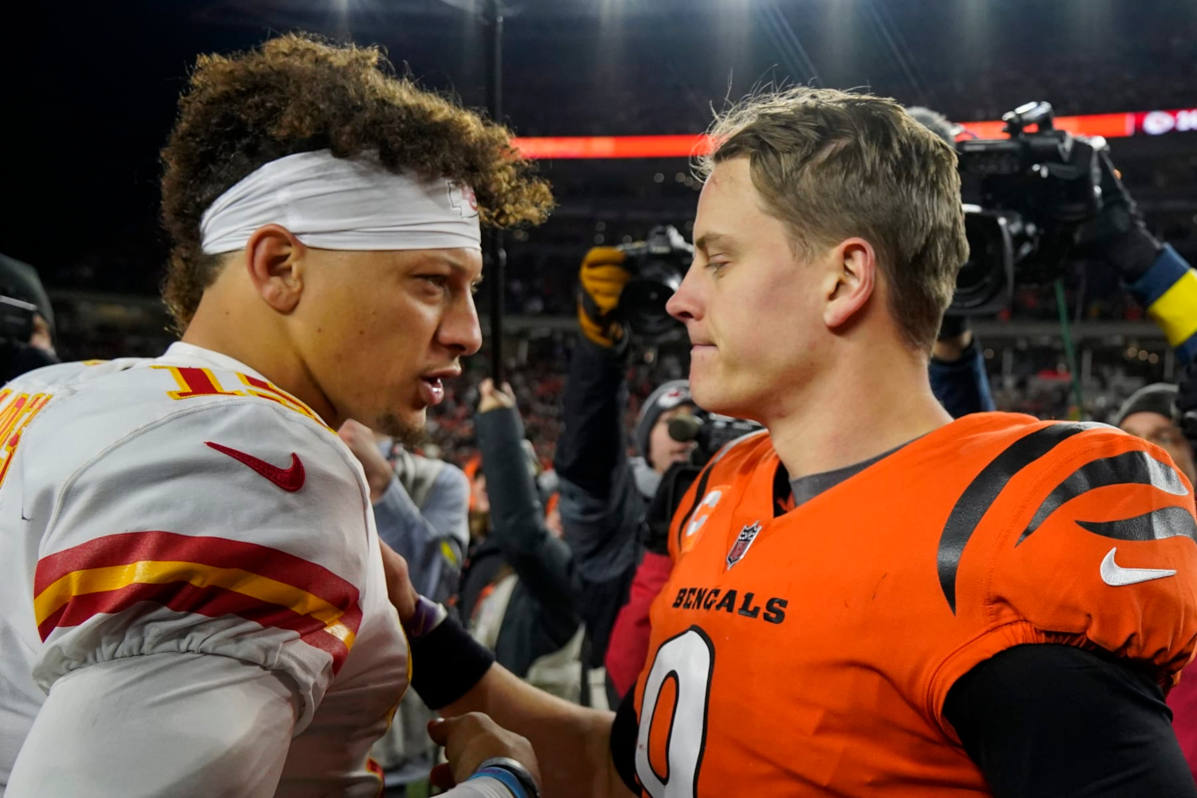 Cincinnati Bengals quarterback Joe Burrow (9) speaks with Kansas City Chiefs quarterback Patrick Mahomes (15) following an NFL football game, Sunday, Dec. 4, 2022, in Cincinnati. (AP Photo/Jeff Dean) Cincinnati Bengals quarterback Joe Burrow (9) speaks with Kansas City Chiefs quarterback Patrick Mahomes (15) following an NFL football game, Sunday, Dec. 4, 2022, in Cincinnati. (AP Photo/Jeff Dean)