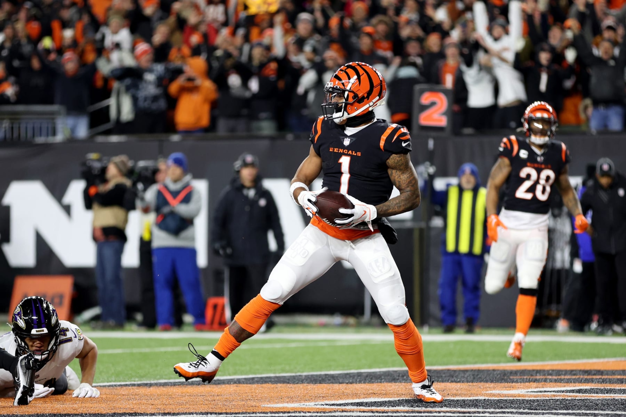 CINCINNATI, OHIO - JANUARY 15: Ja'Marr Chase #1 of the Cincinnati Bengals celebrates after scoring a 7 yard touchdown against the Baltimore Ravens during the second quarter in the AFC Wild Card playoff game at Paycor Stadium on January 15, 2023 in Cincinnati, Ohio. (Photo by Rob Carr/Getty Images)