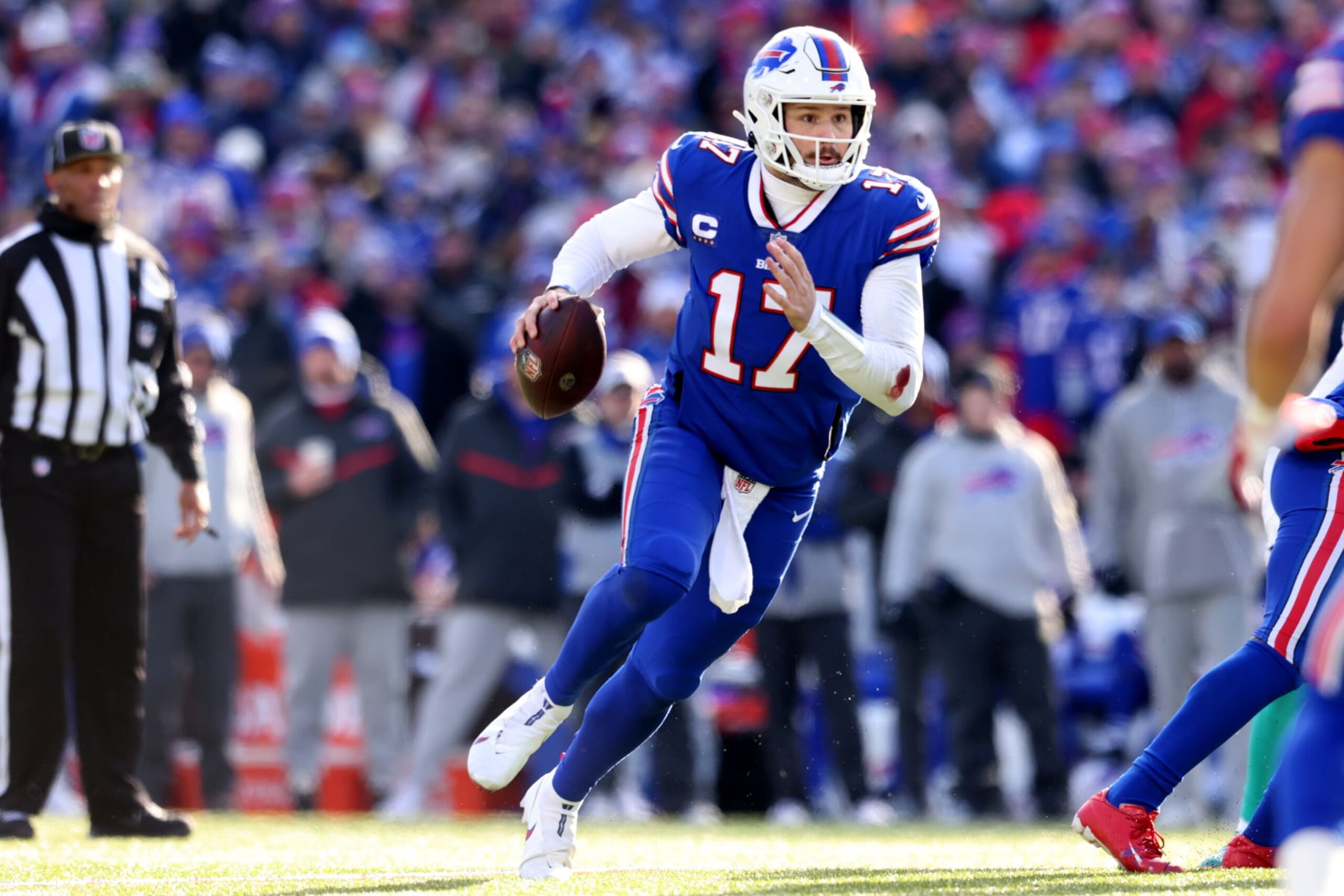 ORCHARD PARK, NEW YORK - JANUARY 15: Josh Allen #17 of the Buffalo Bills looks to pass against the Miami Dolphins during the first half in the AFC Wild Card playoff game at Highmark Stadium on January 15, 2023 in Orchard Park, New York. (Photo by Bryan M. Bennett/Getty Images)