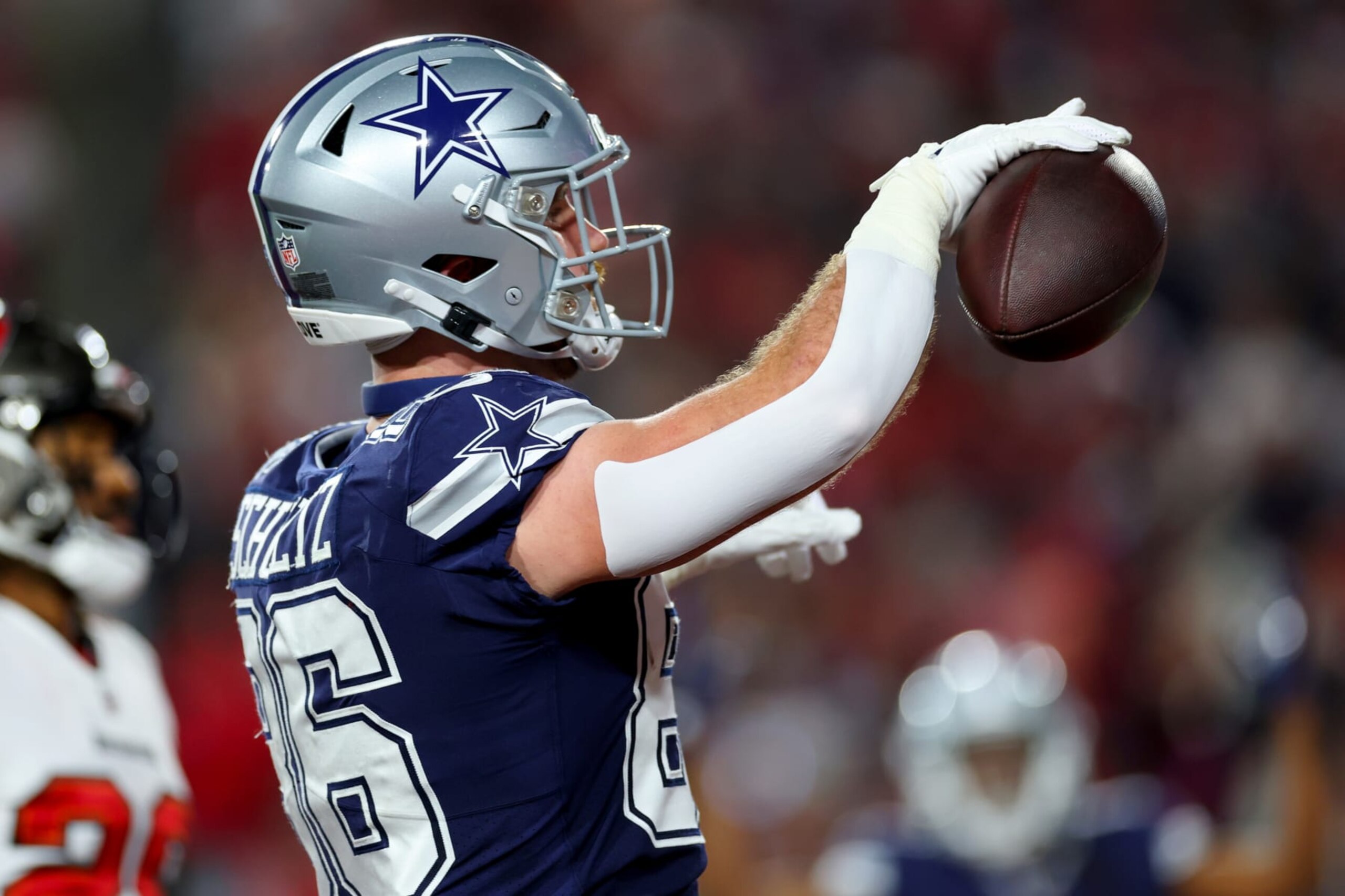 TAMPA, FLORIDA - JANUARY 16: Dalton Schultz #86 of the Dallas Cowboys celebrates after scoring a touchdown against the Tampa Bay Buccaneers during the first quarter of the game in the NFC Wild Card playoff game at Raymond James Stadium on January 16, 2023 in Tampa, Florida. (Photo by Mike Ehrmann/Getty Images)