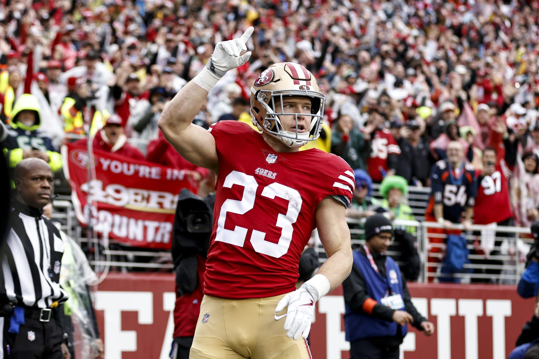 SANTA CLARA, CALIFORNIA - JANUARY 14: Christian McCaffrey #23 of the San Francisco 49ers celebrates after scoring running with the ball for a touchdown during an NFL football game between the San Francisco 49ers and the Seattle Seahawks at Levi's Stadium on January 14, 2023 in Santa Clara, California. (Photo by Michael Owens/Getty Images)