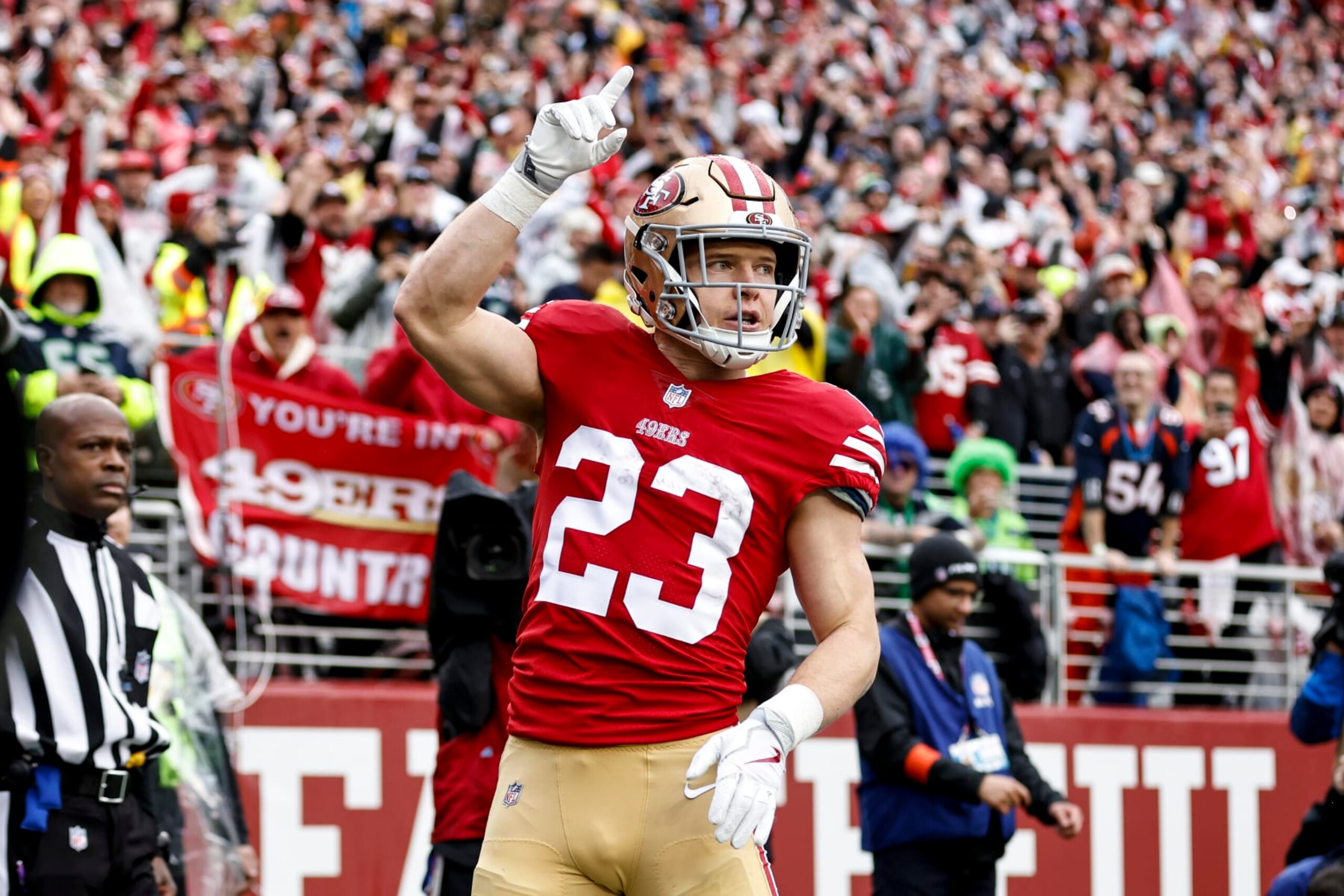 SANTA CLARA, CALIFORNIA - JANUARY 14: Christian McCaffrey #23 of the San Francisco 49ers celebrates after scoring running with the ball for a touchdown during an NFL football game between the San Francisco 49ers and the Seattle Seahawks at Levi's Stadium on January 14, 2023 in Santa Clara, California. (Photo by Michael Owens/Getty Images)