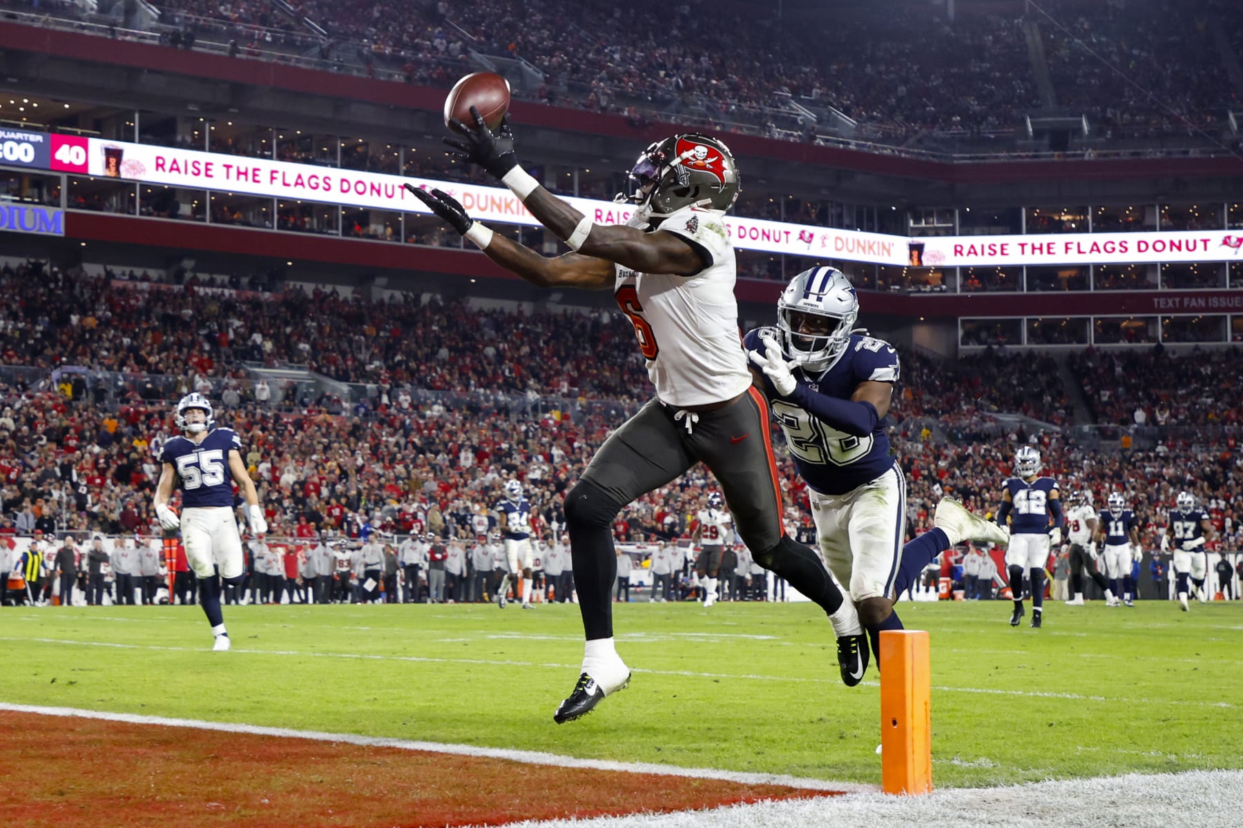TAMPA, FLORIDA - JANUARY 16: Julio Jones #6 of the Tampa Bay Buccaneers catches a touchdown pass against the Dallas Cowboys during the third quarter in the NFC Wild Card playoff game at Raymond James Stadium on January 16, 2023 in Tampa, Florida. (Photo by Mike Ehrmann/Getty Images)