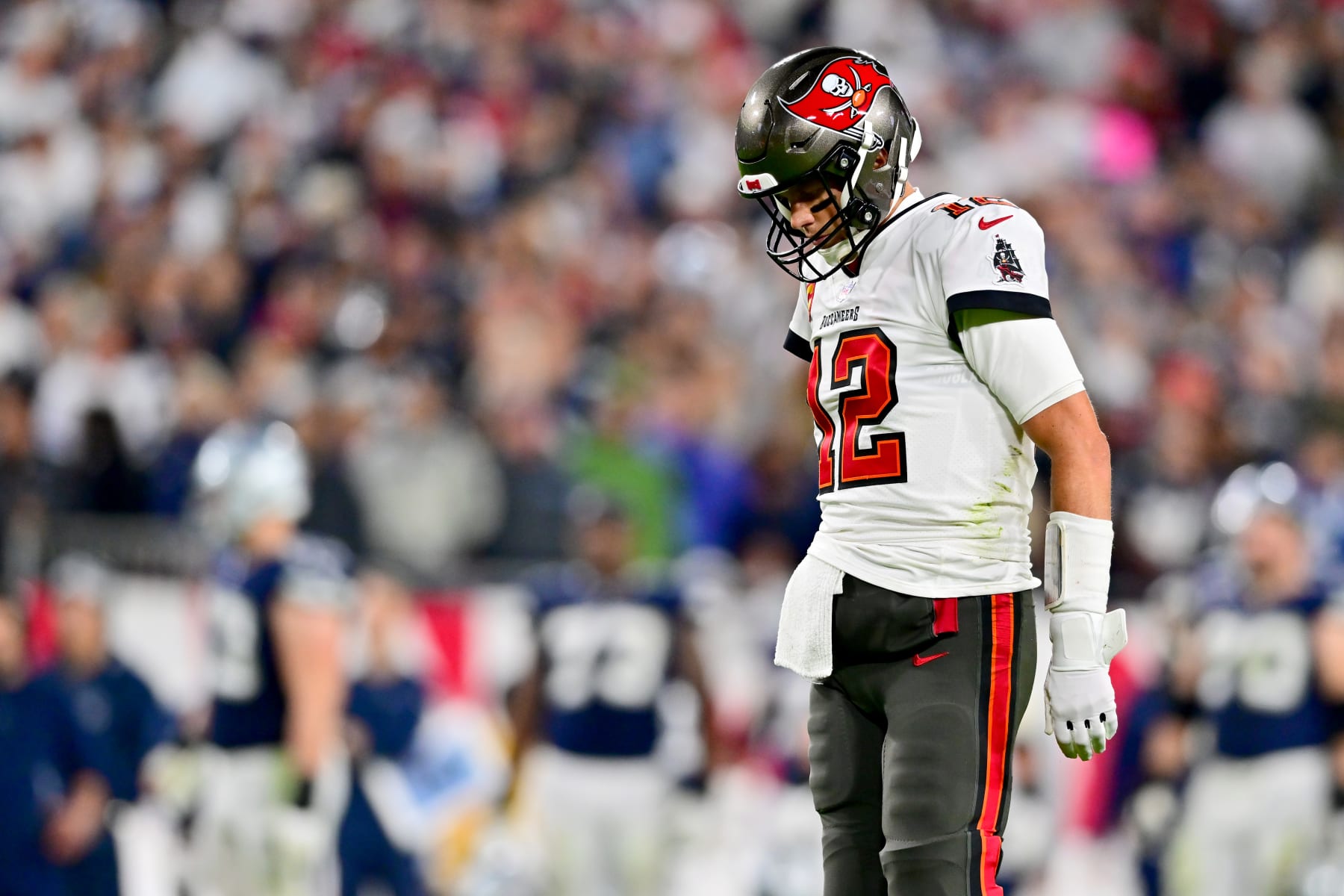TAMPA, FLORIDA - JANUARY 16: Tom Brady #12 of the Tampa Bay Buccaneers looks on after a fumble against the Dallas Cowboys during the third quarter in the NFC Wild Card playoff game at Raymond James Stadium on January 16, 2023 in Tampa, Florida. (Photo by Julio Aguilar/Getty Images)