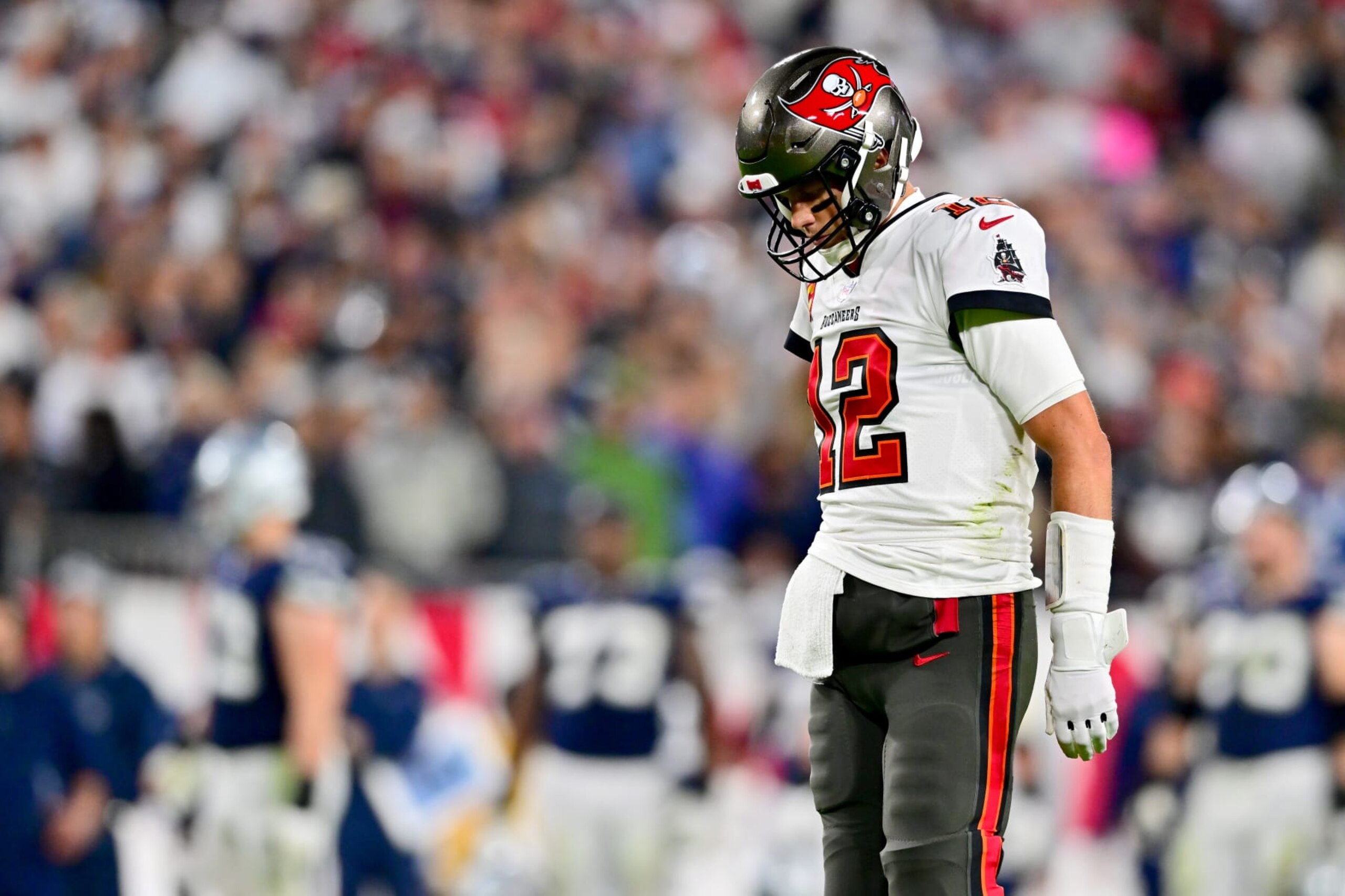 TAMPA, FLORIDA - JANUARY 16: Tom Brady #12 of the Tampa Bay Buccaneers looks on after a fumble against the Dallas Cowboys during the third quarter in the NFC Wild Card playoff game at Raymond James Stadium on January 16, 2023 in Tampa, Florida. (Photo by Julio Aguilar/Getty Images) TAMPA, FLORIDA - JANUARY 16: Tom Brady #12 of the Tampa Bay Buccaneers looks on after a fumble against the Dallas Cowboys during the third quarter in the NFC Wild Card playoff game at Raymond James Stadium on January 16, 2023 in Tampa, Florida. (Photo by Julio Aguilar/Getty Images)