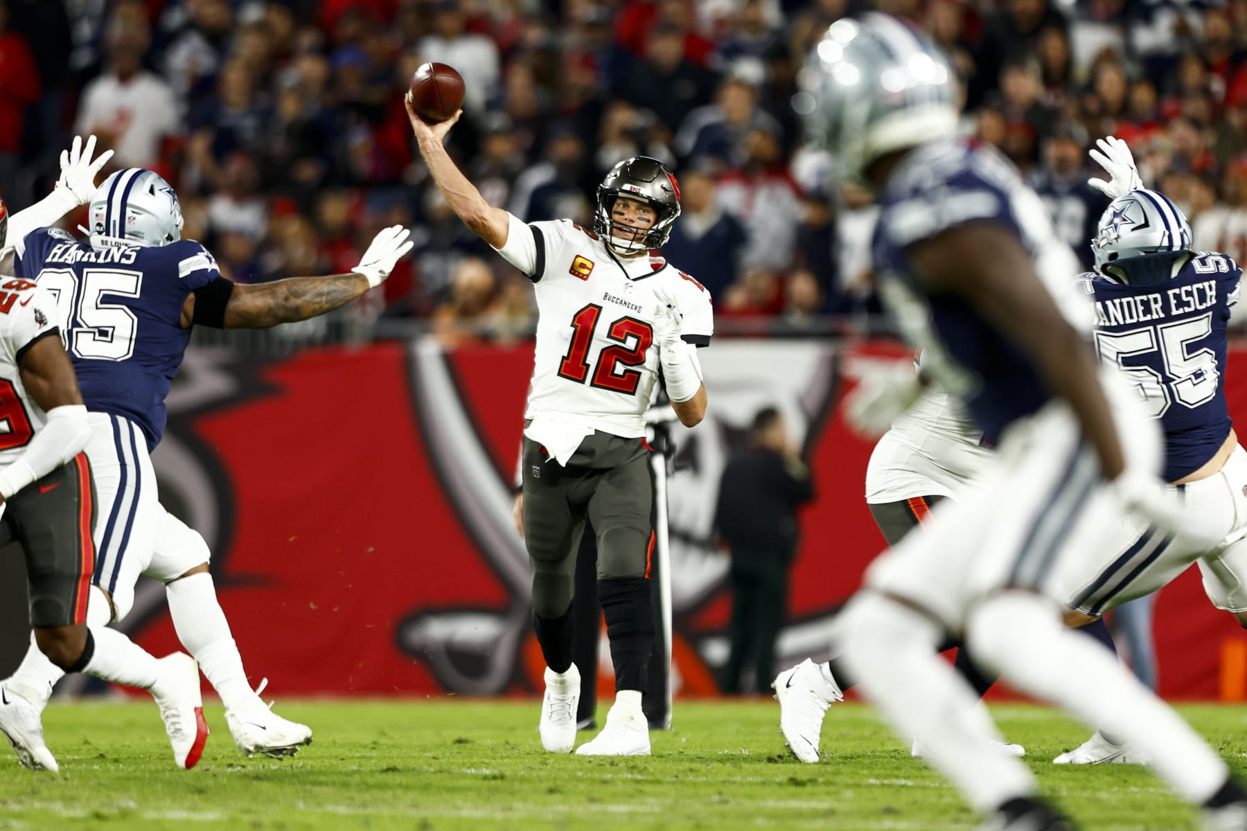 TAMPA, FL - JANUARY 16: Tom Brady #12 of the Tampa Bay Buccaneers throws a pass during the first quarter of an NFL wild card playoff football game against the Dallas Cowboys at Raymond James Stadium on January 16, 2023 in Tampa, Florida. (Photo by Kevin Sabitus/Getty Images)