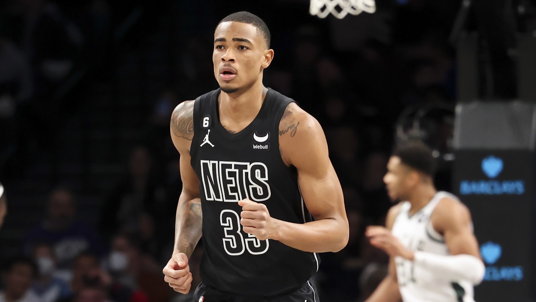 Brooklyn Nets center Nic Claxton (33) runs down the court during the first half of an NBA basketball game against the Milwaukee Bucks, Friday, Dec. 23, 2022, in New York. (AP Photo/Jessie Alcheh)