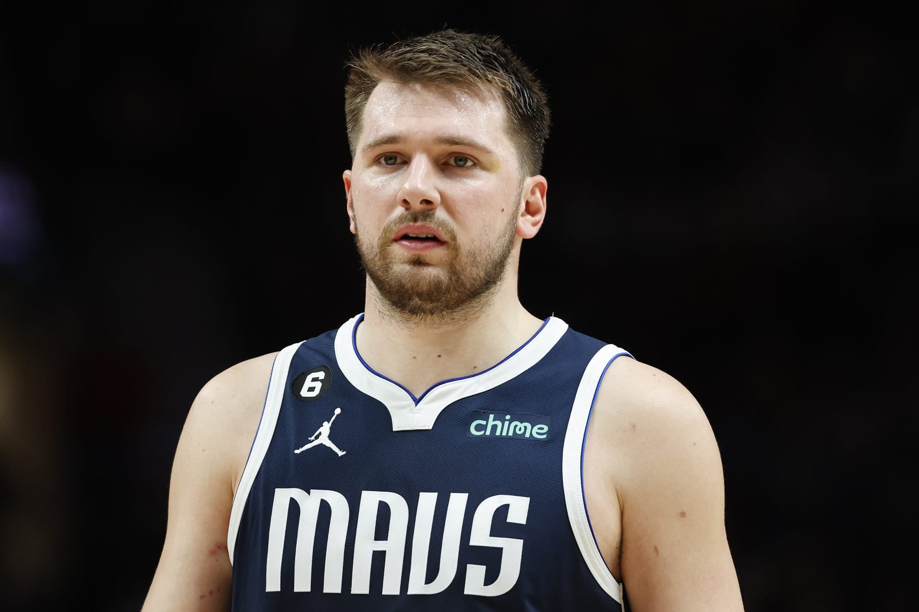 PORTLAND, OREGON - JANUARY 14: Luka Doncic #77 of the Dallas Mavericks looks on during the fourth quarter of the game against the Portland Trail Blazers at Moda Center on January 14, 2023 in Portland, Oregon. NOTE TO USER: User expressly acknowledges and agrees that, by downloading and or using this photograph, user is consenting to the terms and conditions of the Getty Images License Agreement. (Photo by Steph Chambers/Getty Images)