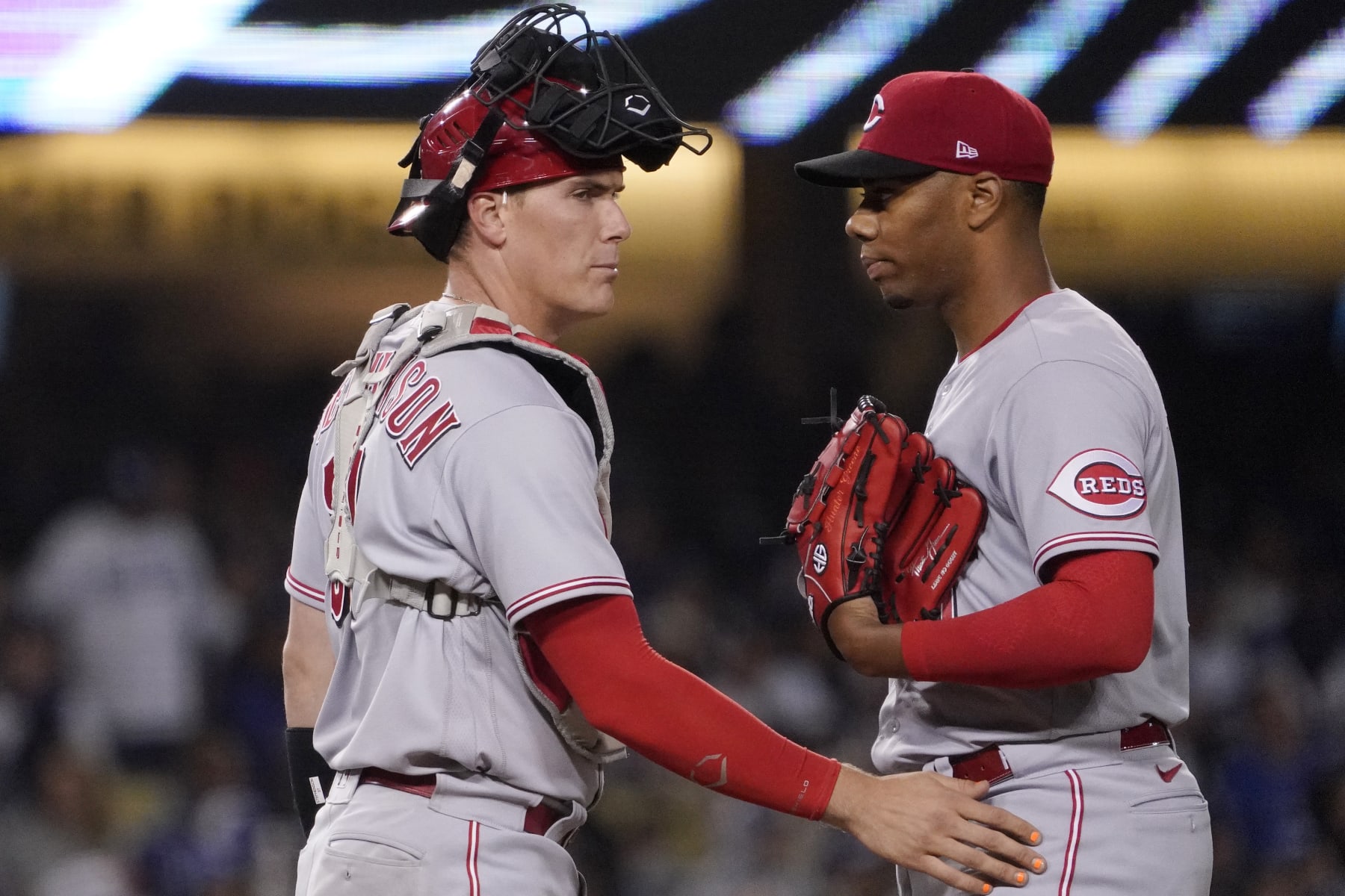 Cincinnati Reds catcher Tyler Stephenson, talks with starting pitcher Hunter Greene before Greene is taken out during the sixth inning of a baseball game against the Los Angeles Dodgers Saturday, April 16, 2022, in Los Angeles. (AP Photo/Mark J. Terrill)