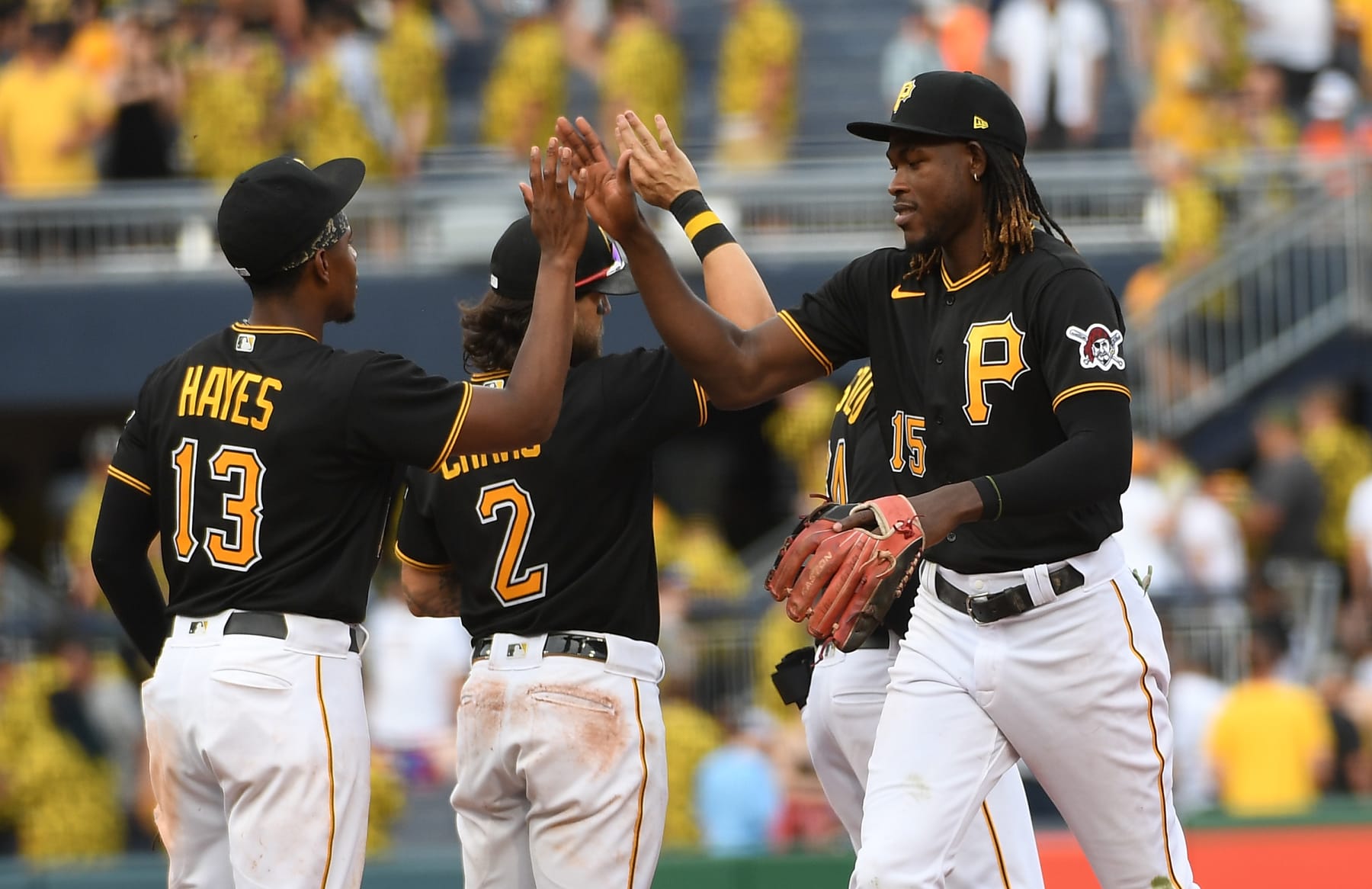 PITTSBURGH, PA - JULY 02: Oneil Cruz #15 of the Pittsburgh Pirates high fives with Ke'Bryan Hayes #13 after the final out in a 7-4 win over the Milwaukee Brewers during the game at PNC Park on July 2, 2022 in Pittsburgh, Pennsylvania. (Photo by Justin Berl/Getty Images)