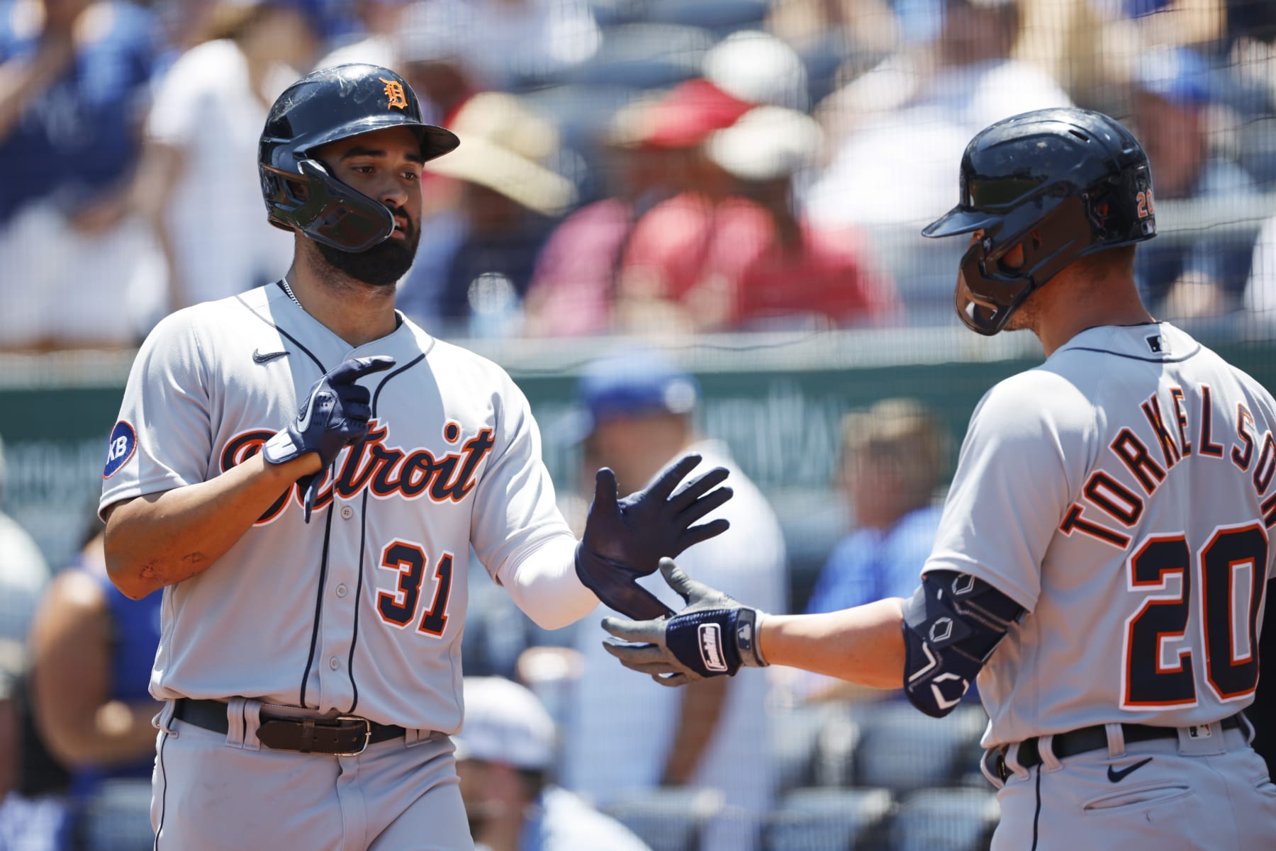 Detroit Tigers' Riley Greene (31) is congratulated by Spencer Torkelson (20) after scoring off a sacrifice fly by Harold Castro during the first inning of a baseball game in Kansas City, Mo., Wednesday, July 13, 2022. (AP Photo/Colin E. Braley)