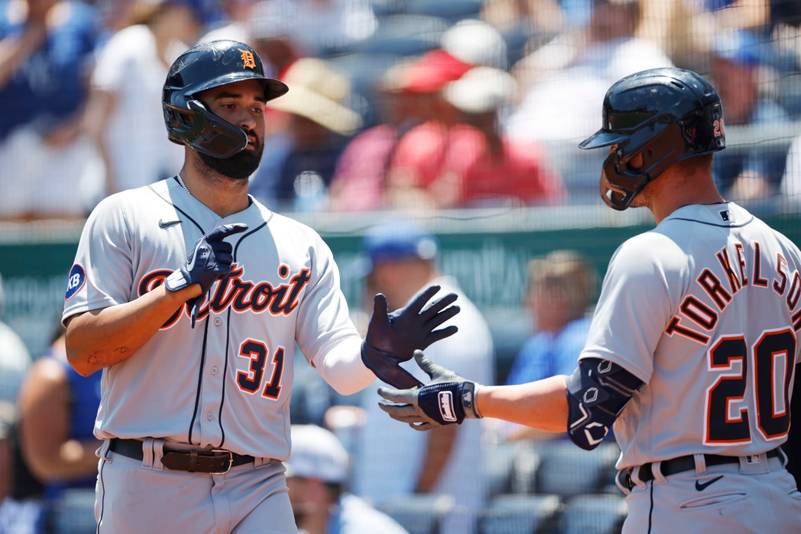 Detroit Tigers' Riley Greene (31) is congratulated by Spencer Torkelson (20) after scoring off a sacrifice fly by Harold Castro during the first inning of a baseball game in Kansas City, Mo., Wednesday, July 13, 2022. (AP Photo/Colin E. Braley)