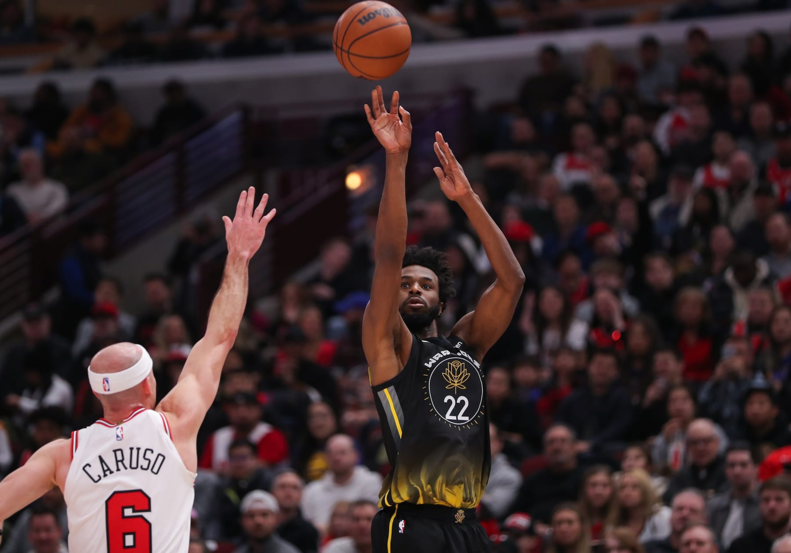CHICAGO, IL - JANUARY 15: Golden State Warriors Forward Andrew Wiggins (22) shoots a 3-point basket during a NBA game between the Golden State  Warriors and the Chicago Bulls on January 15, 2023 at the United Center in Chicago, IL. (Photo by Melissa Tamez/Icon Sportswire via Getty Images)