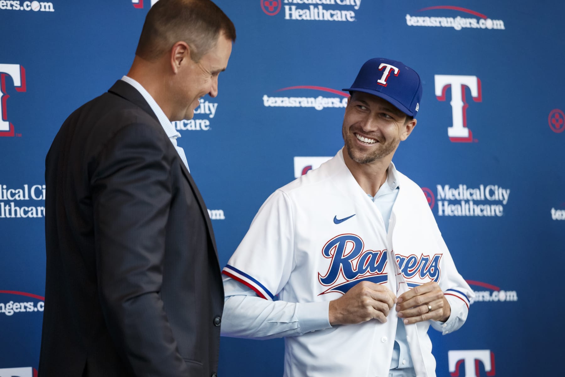 ARLINGTON, TX - DECEMBER 08: Jacob deGrom #48 and General Manager Chris Young of the Texas Rangers reacts at an introductory press conference at Globe Life Field on December 8, 2022 in Arlington, Texas. (Photo by Bailey Orr/Texas Rangers/Getty Images)