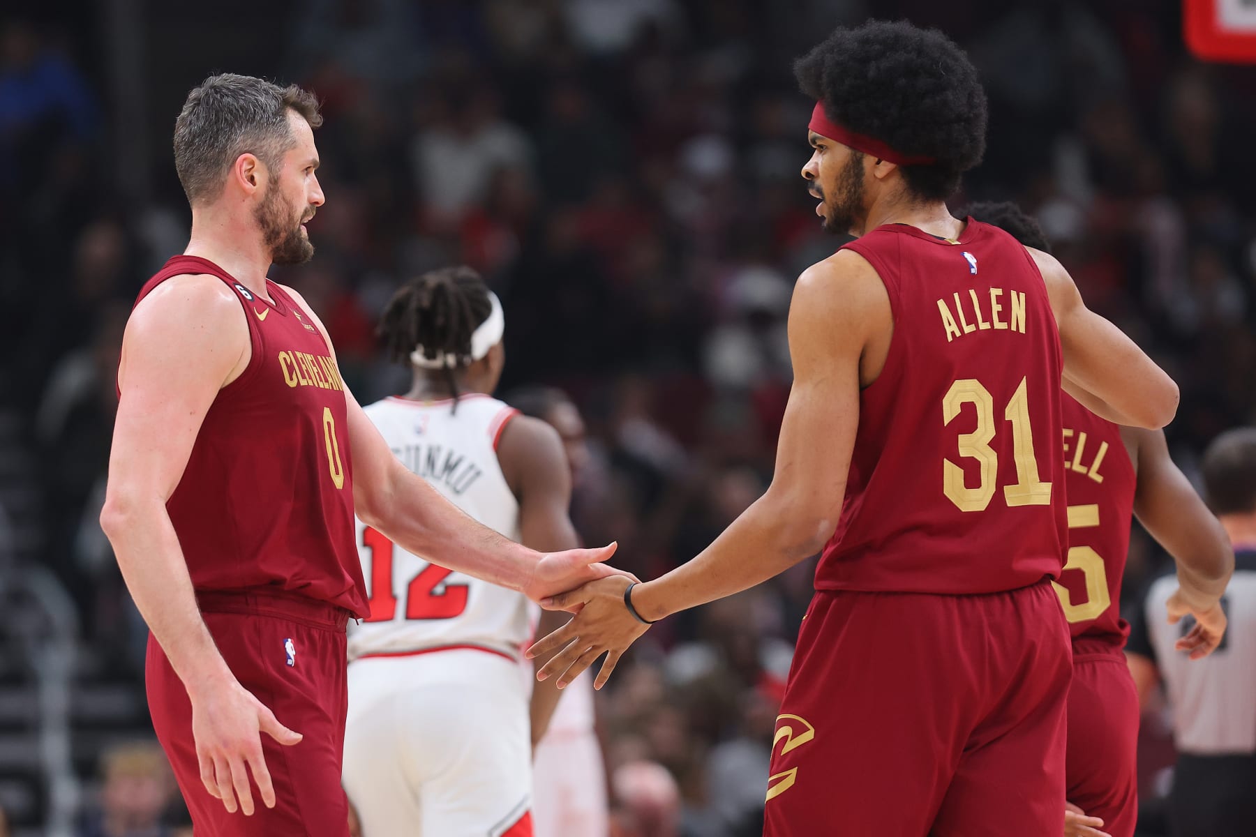 CHICAGO, ILLINOIS - DECEMBER 31: Kevin Love #0 of the Cleveland Cavaliers high fives Jarrett Allen #31 against the Chicago Bulls during the first half at United Center on December 31, 2022 in Chicago, Illinois. NOTE TO USER: User expressly acknowledges and agrees that, by downloading and or using this photograph, User is consenting to the terms and conditions of the Getty Images License Agreement. (Photo by Michael Reaves/Getty Images)