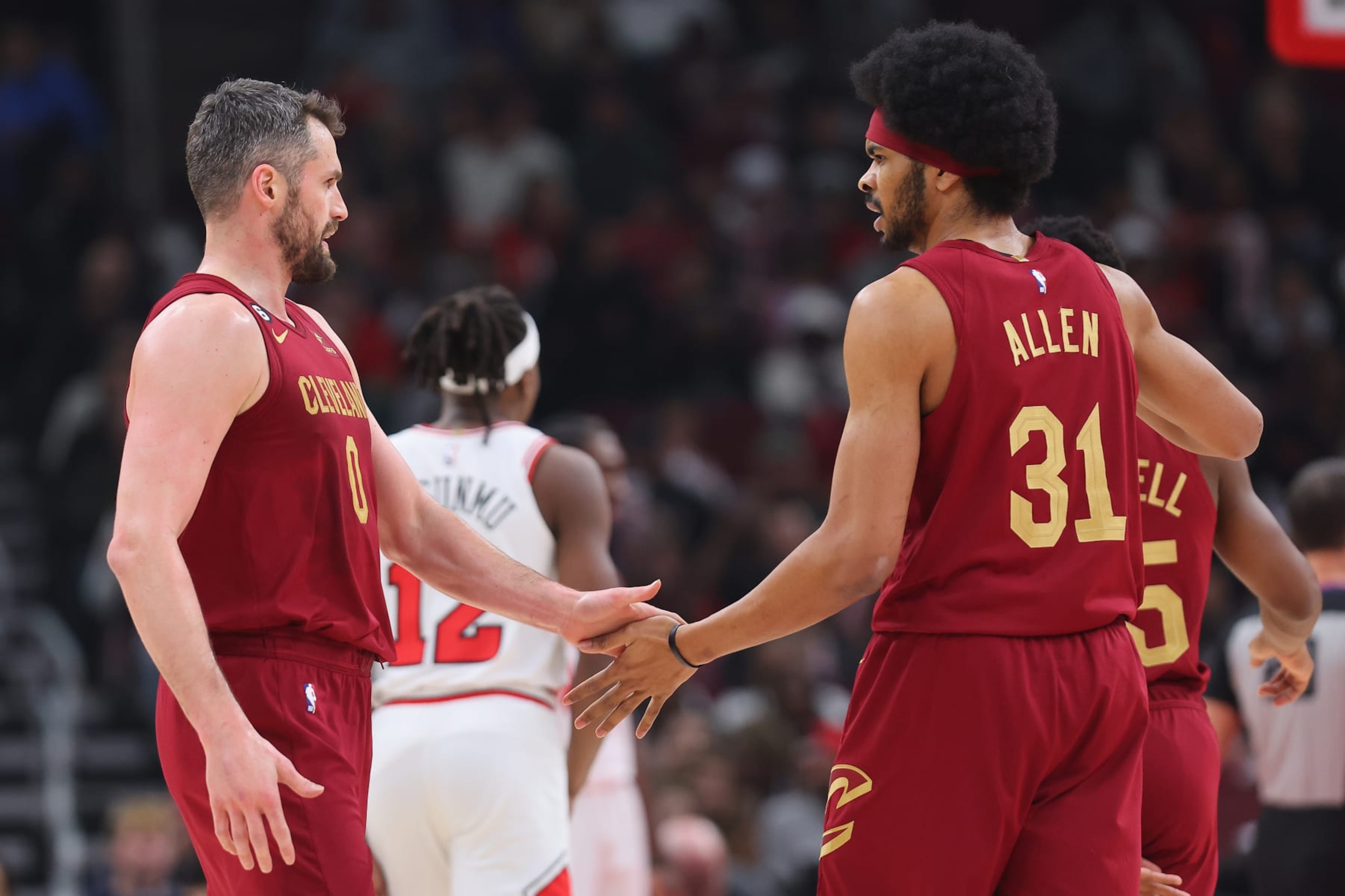 CHICAGO, ILLINOIS - DECEMBER 31: Kevin Love #0 of the Cleveland Cavaliers high fives Jarrett Allen #31 against the Chicago Bulls during the first half at United Center on December 31, 2022 in Chicago, Illinois. NOTE TO USER: User expressly acknowledges and agrees that, by downloading and or using this photograph, User is consenting to the terms and conditions of the Getty Images License Agreement. (Photo by Michael Reaves/Getty Images) CHICAGO, ILLINOIS - DECEMBER 31: Kevin Love #0 of the Cleveland Cavaliers high fives Jarrett Allen #31 against the Chicago Bulls during the first half at United Center on December 31, 2022 in Chicago, Illinois. NOTE TO USER: User expressly acknowledges and agrees that, by downloading and or using this photograph, User is consenting to the terms and conditions of the Getty Images License Agreement. (Photo by Michael Reaves/Getty Images)