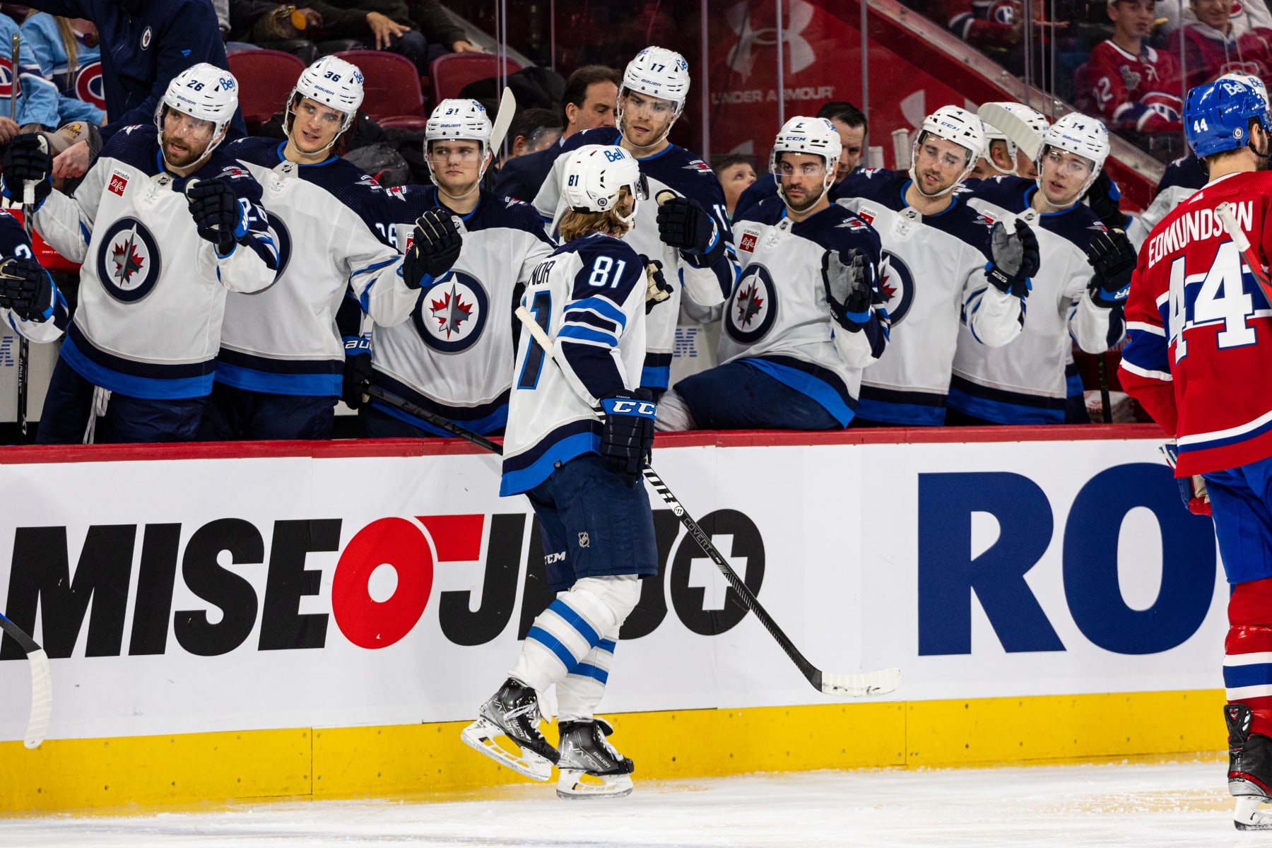 MONTREAL, CANADA - JANUARY 17: Kyle Connor #81 of the Winnipeg Jets celebrates a goal with the bench during the second period of the NHL regular season game between the Montreal Canadiens and the Winnipeg Jets at the Bell Centre on January 17, 2023 in Montreal, Quebec, Canada. (Photo by Vitor Munhoz/NHLI via Getty Images)