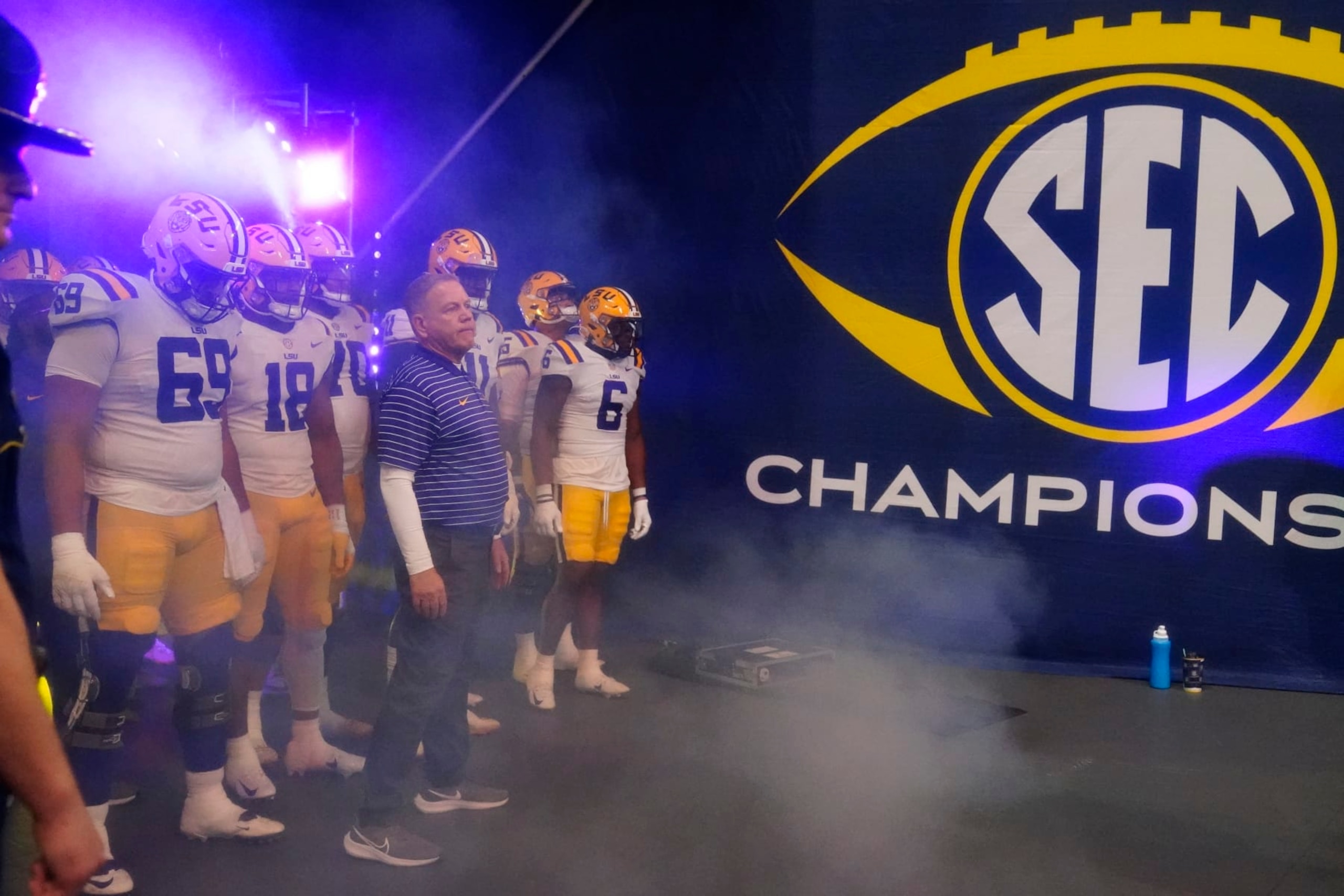 LSU head coach Brian Kelly and the team wait to enter the field before the Southeastern Conference championship NCAA college football game against Georgia, Saturday, Dec. 3, 2022, in Atlanta. (AP Photo/Brynn Anderson) LSU head coach Brian Kelly and the team wait to enter the field before the Southeastern Conference championship NCAA college football game against Georgia, Saturday, Dec. 3, 2022, in Atlanta. (AP Photo/Brynn Anderson)