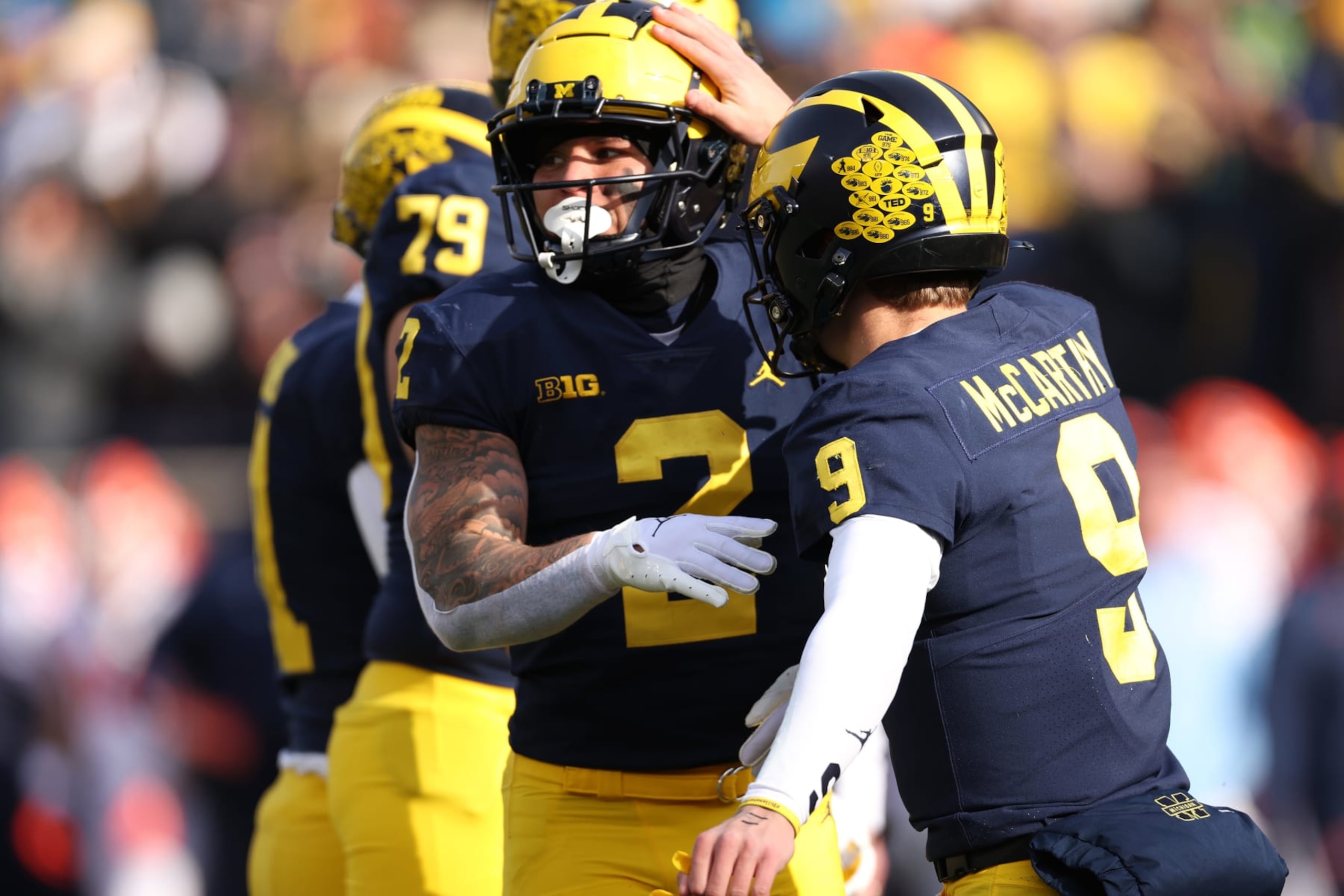 ANN ARBOR, MICHIGAN - NOVEMBER 19: Blake Corum #2 of the Michigan Wolverines celebrates his first half touchdown with J.J. McCarthy #9 while playing the Illinois Fighting Illini at Michigan Stadium on November 19, 2022 in Ann Arbor, Michigan. (Photo by Gregory Shamus/Getty Images) ANN ARBOR, MICHIGAN - NOVEMBER 19: Blake Corum #2 of the Michigan Wolverines celebrates his first half touchdown with J.J. McCarthy #9 while playing the Illinois Fighting Illini at Michigan Stadium on November 19, 2022 in Ann Arbor, Michigan. (Photo by Gregory Shamus/Getty Images)