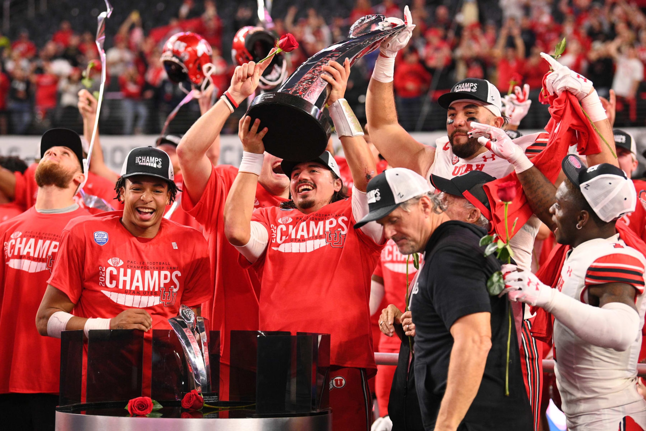 LAS VEGAS, NV - DECEMBER 02: Utah Utes quarterback Cameron Rising (7) holds up the trophy after the Pac-12 Conference championship game between the Utah Utes and the USC Trojans at Allegiant Stadium on December 2, 2022 in Las Vegas, Nevada. (Photo by Brian Rothmuller/Icon Sportswire via Getty Images)
