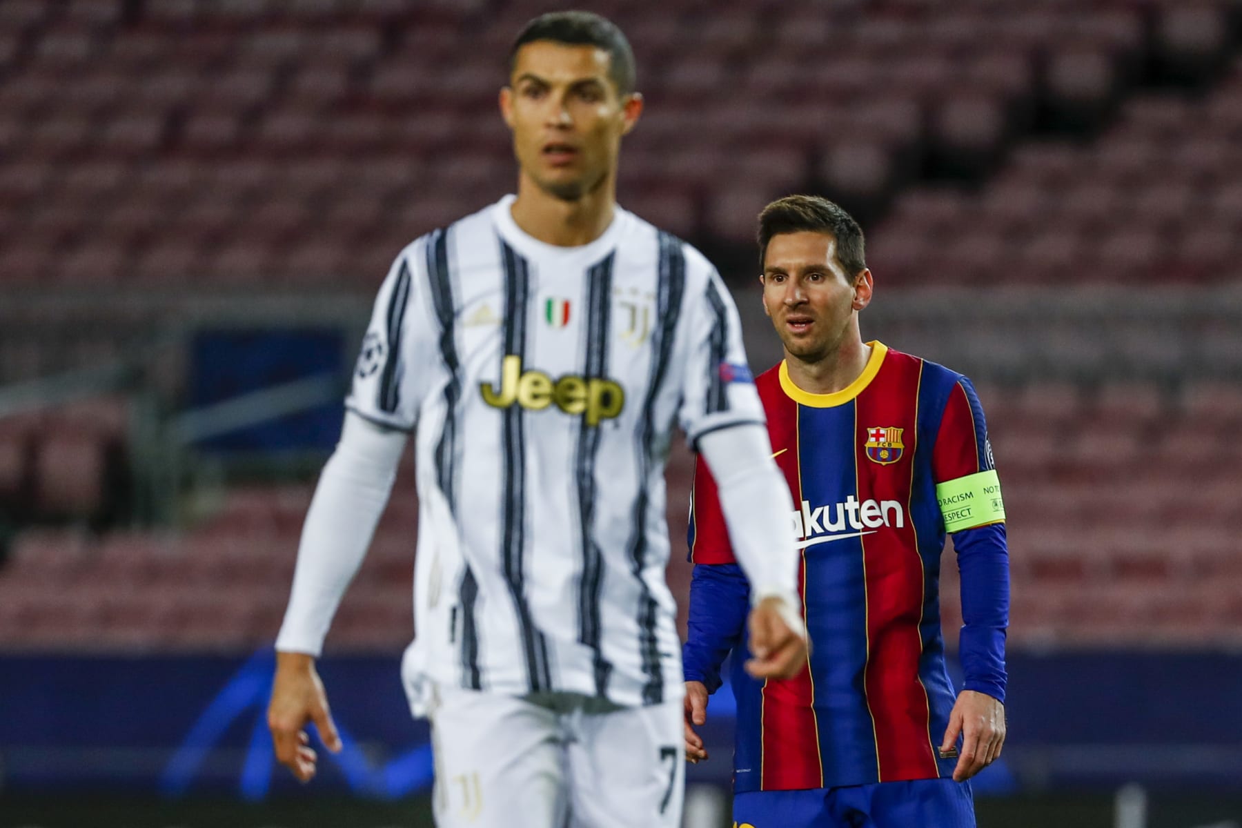 Barcelona's Lionel Messi, right, and Juventus' Cristiano Ronaldo during the Champions League group G soccer match between FC Barcelona and Juventus at the Camp Nou stadium in Barcelona, Spain, Tuesday, Dec. 8, 2020. (AP Photo/Joan Monfort)
