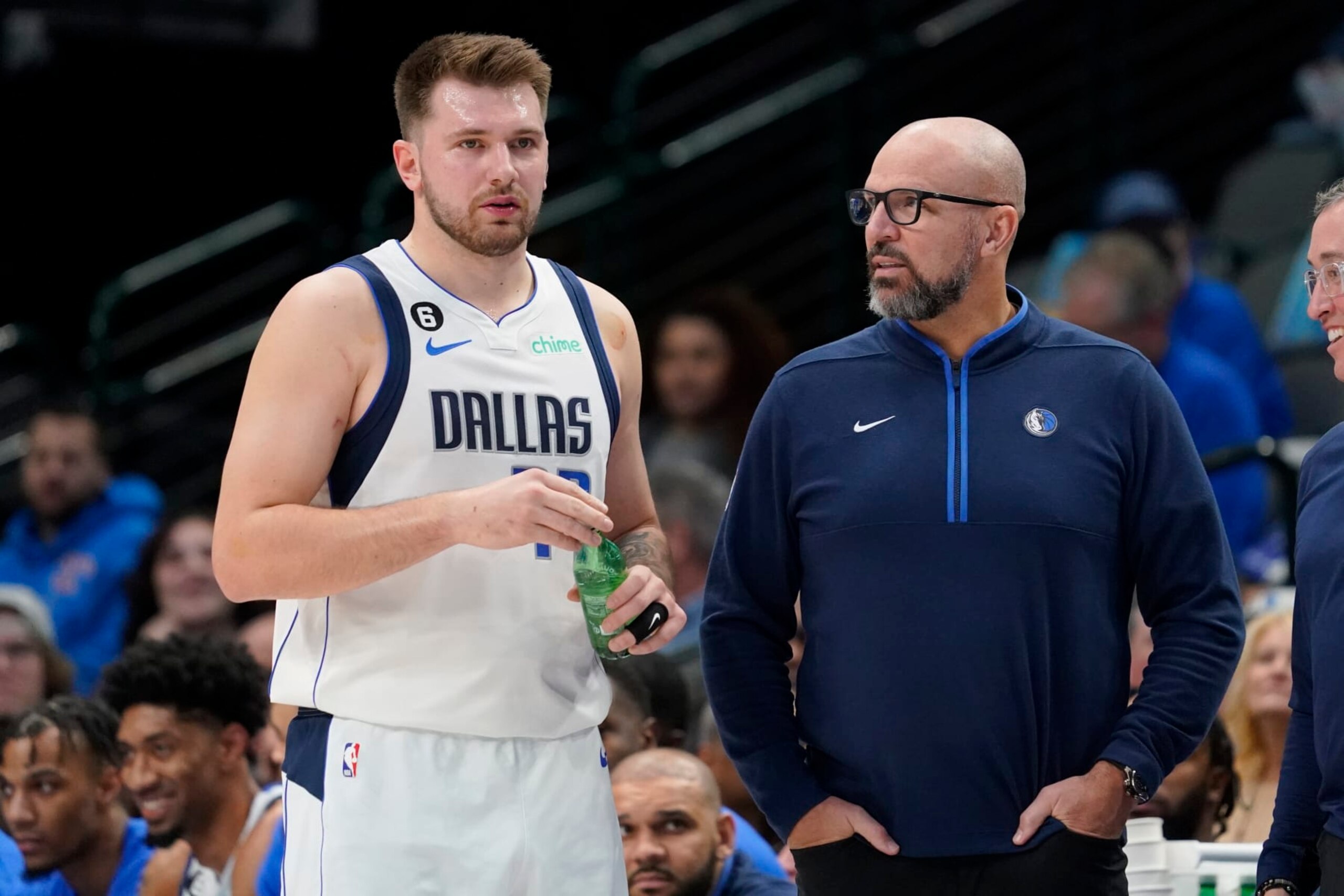 DALLAS, TEXAS - JANUARY 07: Luka Doncic #77 of the Dallas Mavericks and head coach Jason Kidd talk on the court during the first half of the game against the New Orleans Pelicans at American Airlines Center on January 07, 2023 in Dallas, Texas. NOTE TO USER: User expressly acknowledges and agrees that, by downloading and or using this photograph, User is consenting to the terms and conditions of the Getty Images License Agreement. (Photo by Sam Hodde/Getty Images)