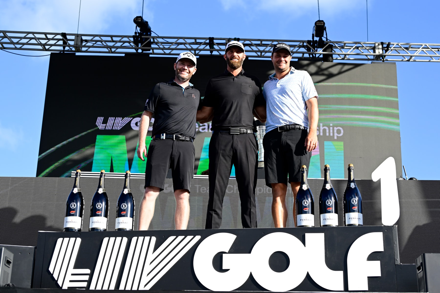 DORAL, FLORIDA - OCTOBER 30: Individual champion team Captain Dustin Johnson (C) of 4 Aces GC, second place individual award winner Branden Grace (L) of Stinger GC, and third place individual award winner Peter Uihlein (R) of Smash GC pose on stage after the team championship stroke-play round of the LIV Golf Invitational - Miami at Trump National Doral Miami on October 30, 2022 in Doral, Florida. (Photo by Charles Laberge/LIV Golf via Getty Images) DORAL, FLORIDA - OCTOBER 30: Individual champion team Captain Dustin Johnson (C) of 4 Aces GC, second place individual award winner Branden Grace (L) of Stinger GC, and third place individual award winner Peter Uihlein (R) of Smash GC pose on stage after the team championship stroke-play round of the LIV Golf Invitational - Miami at Trump National Doral Miami on October 30, 2022 in Doral, Florida. (Photo by Charles Laberge/LIV Golf via Getty Images)