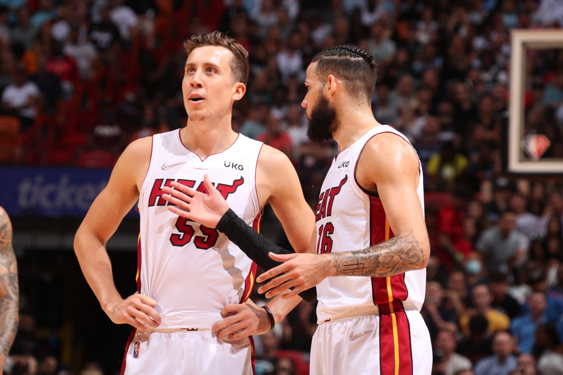MIAMI, FL - APRIL 5: Duncan Robinson #55 talks to Caleb Martin #16 of the Miami Heat during the game against the Charlotte Hornets on April 5, 2022 at FTX Arena in Miami, Florida. NOTE TO USER: User expressly acknowledges and agrees that, by downloading and or using this Photograph, user is consenting to the terms and conditions of the Getty Images License Agreement. Mandatory Copyright Notice: Copyright 2022 NBAE (Photo by Issac Baldizon/NBAE via Getty Images)