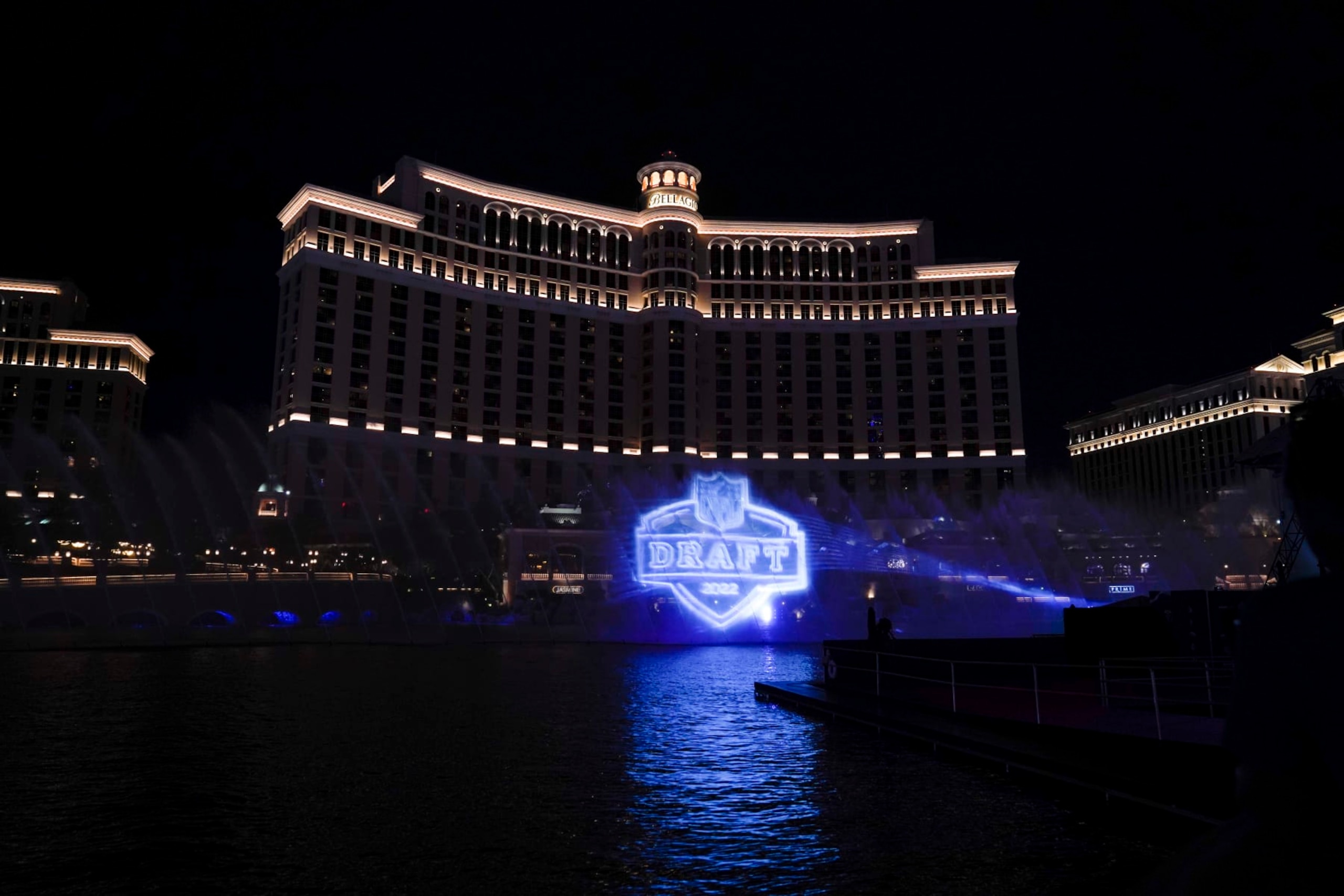 A logo of the 2022 NFL football draft is projected at the Fountains of Bellagio on Wednesday, April 27, 2022, in Las Vegas, the day before the draft. (AP Photo/Jae C. Hong)