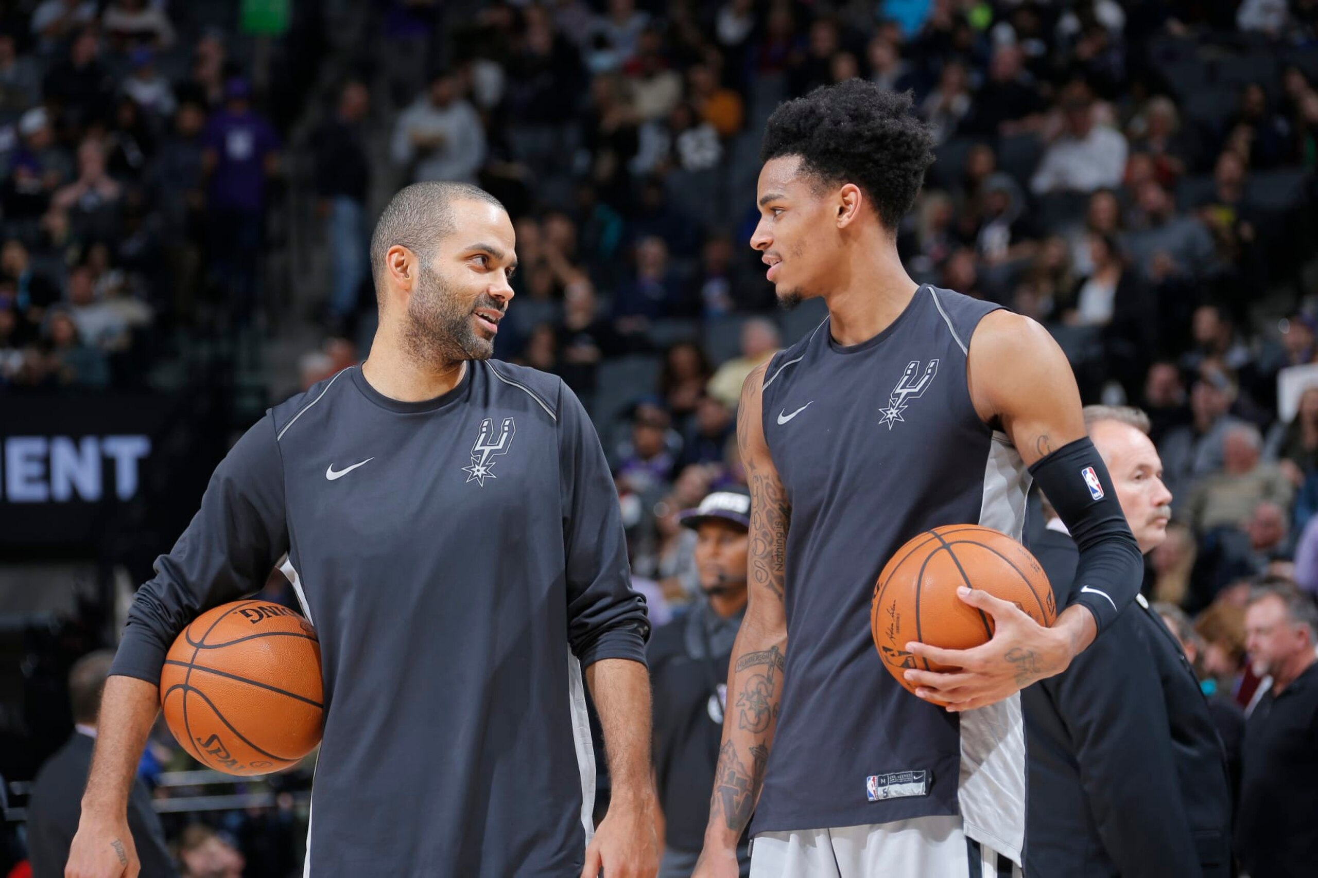 SACRAMENTO, CA - DECEMBER 23: Tony Parker #9 and Dejounte Murray #5 of the San Antonio Spurs warm up against the Sacramento Kings on December 23, 2017 at Golden 1 Center in Sacramento, California. NOTE TO USER: User expressly acknowledges and agrees that, by downloading and or using this photograph, User is consenting to the terms and conditions of the Getty Images Agreement. Mandatory Copyright Notice: Copyright 2017 NBAE (Photo by Rocky Widner/NBAE via Getty Images)