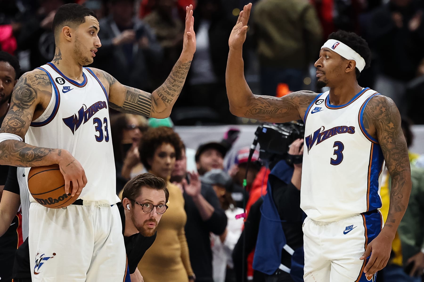 WASHINGTON, DC - NOVEMBER 18: Kyle Kuzma #33 and Bradley Beal #3 of the Washington Wizards celebrate after an overtime win against the Miami Heat at Capital One Arena on November 18, 2022 in Washington, DC. NOTE TO USER: User expressly acknowledges and agrees that, by downloading and or using this photograph, User is consenting to the terms and conditions of the Getty Images License Agreement. (Photo by Scott Taetsch/Getty Images)