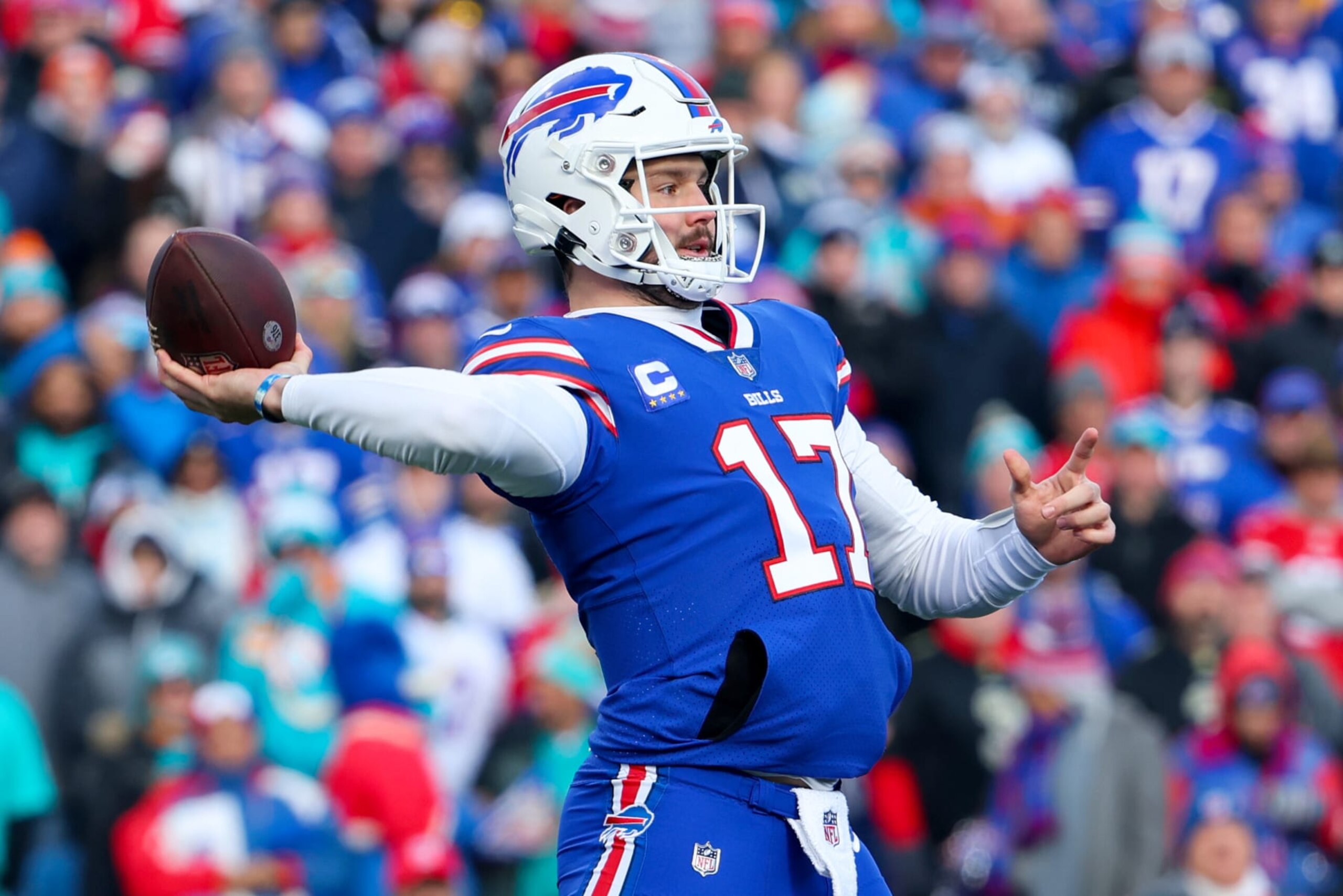ORCHARD PARK, NEW YORK - JANUARY 15: Josh Allen #17 of the Buffalo Bills throws a pass against the Miami Dolphins during the first half in the AFC Wild Card playoff game at Highmark Stadium on January 15, 2023 in Orchard Park, New York. (Photo by Timothy T Ludwig/Getty Images)