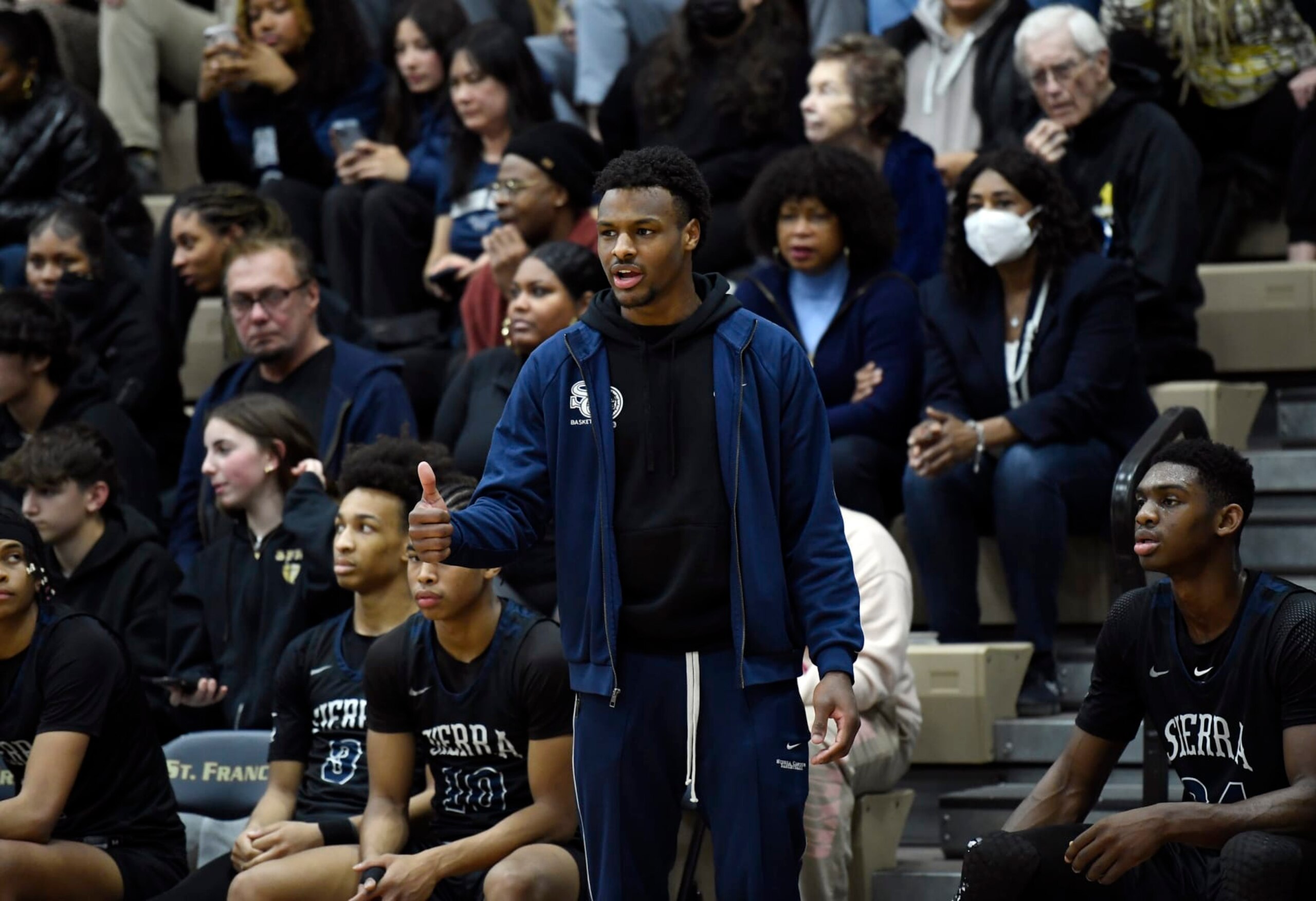 LA CANADA-FLINTRIDGE, CA - JANUARY 18: Bronny James #0 of Sierra Canyon High School, son of LeBron James of the NBA Los Angeles Lakers, cheers on teammates from the bench during the second half against St. Francis High School on January 18, 2023 in La Canada-Flintridge, California. James did not play. (Photo by Kevork Djansezian/Getty Images) LA CANADA-FLINTRIDGE, CA - JANUARY 18: Bronny James #0 of Sierra Canyon High School, son of LeBron James of the NBA Los Angeles Lakers, cheers on teammates from the bench during the second half against St. Francis High School on January 18, 2023 in La Canada-Flintridge, California. James did not play. (Photo by Kevork Djansezian/Getty Images)