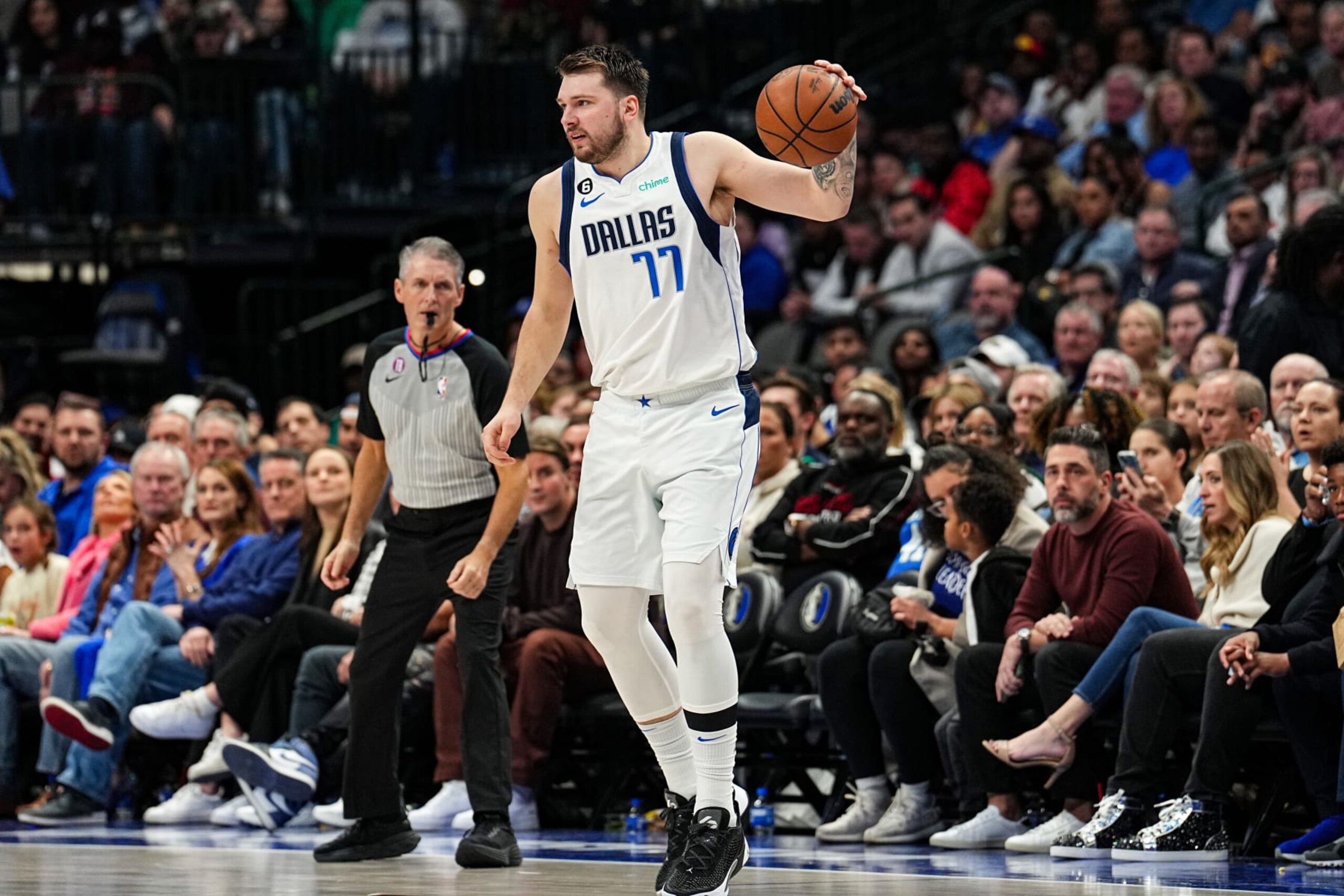DALLAS, TX - JANUARY 18:  Luka Doncic #77 of the Dallas Mavericks dribbles the ball against the Atlanta Hawks on January 18, 2023 at the American Airlines Center in Dallas, Texas. NOTE TO USER: User expressly acknowledges and agrees that, by downloading and or using this Photograph, user is consenting to the terms and conditions of the Getty Images License Agreement. Mandatory Copyright Notice: Copyright 2023 NBAE (Photo by Glenn James/NBAE via Getty Images)