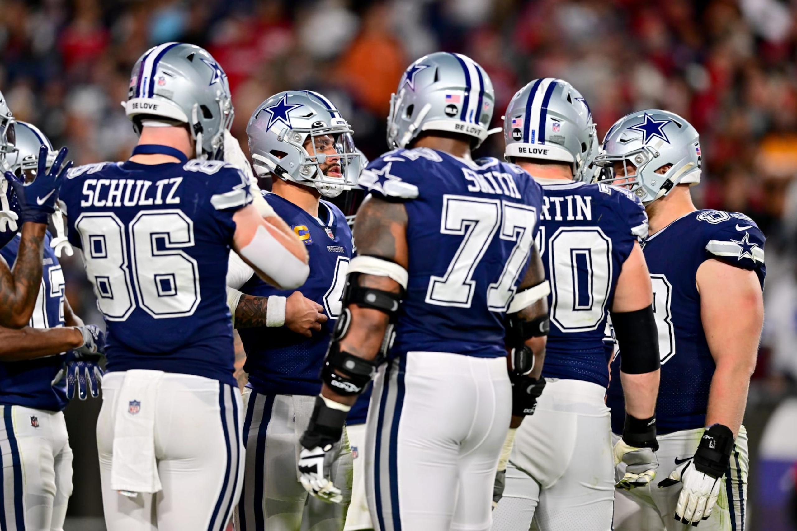 TAMPA, FLORIDA - JANUARY 16: Dak Prescott #4 of the Dallas Cowboys looks on in the huddle against the Tampa Bay Buccaneers during the first half in the NFC Wild Card playoff game at Raymond James Stadium on January 16, 2023 in Tampa, Florida. (Photo by Julio Aguilar/Getty Images) TAMPA, FLORIDA - JANUARY 16: Dak Prescott #4 of the Dallas Cowboys looks on in the huddle against the Tampa Bay Buccaneers during the first half in the NFC Wild Card playoff game at Raymond James Stadium on January 16, 2023 in Tampa, Florida. (Photo by Julio Aguilar/Getty Images)