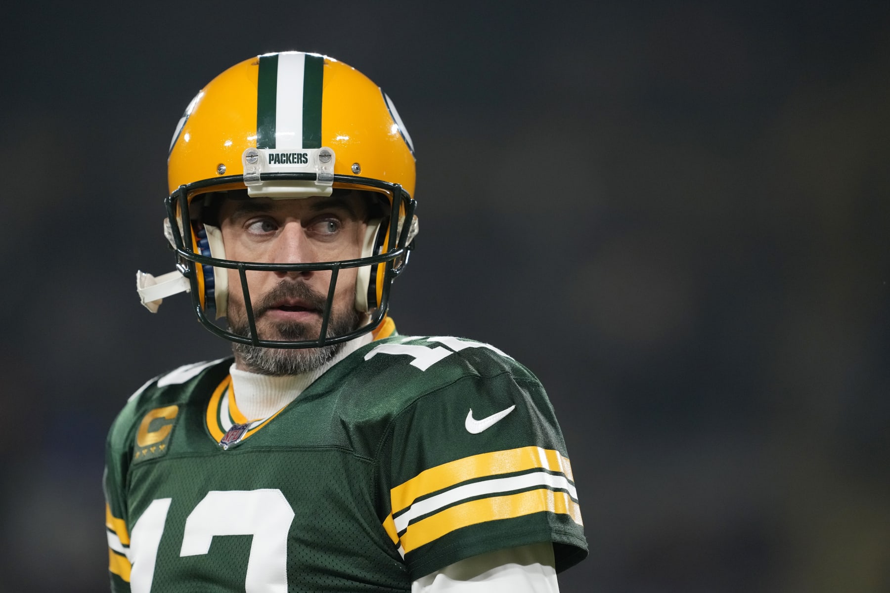 GREEN BAY, WISCONSIN - JANUARY 08: Aaron Rodgers #12 of the Green Bay Packers warms up before a game against the Detroit Lions at Lambeau Field on January 08, 2023 in Green Bay, Wisconsin. (Photo by Patrick McDermott/Getty Images)