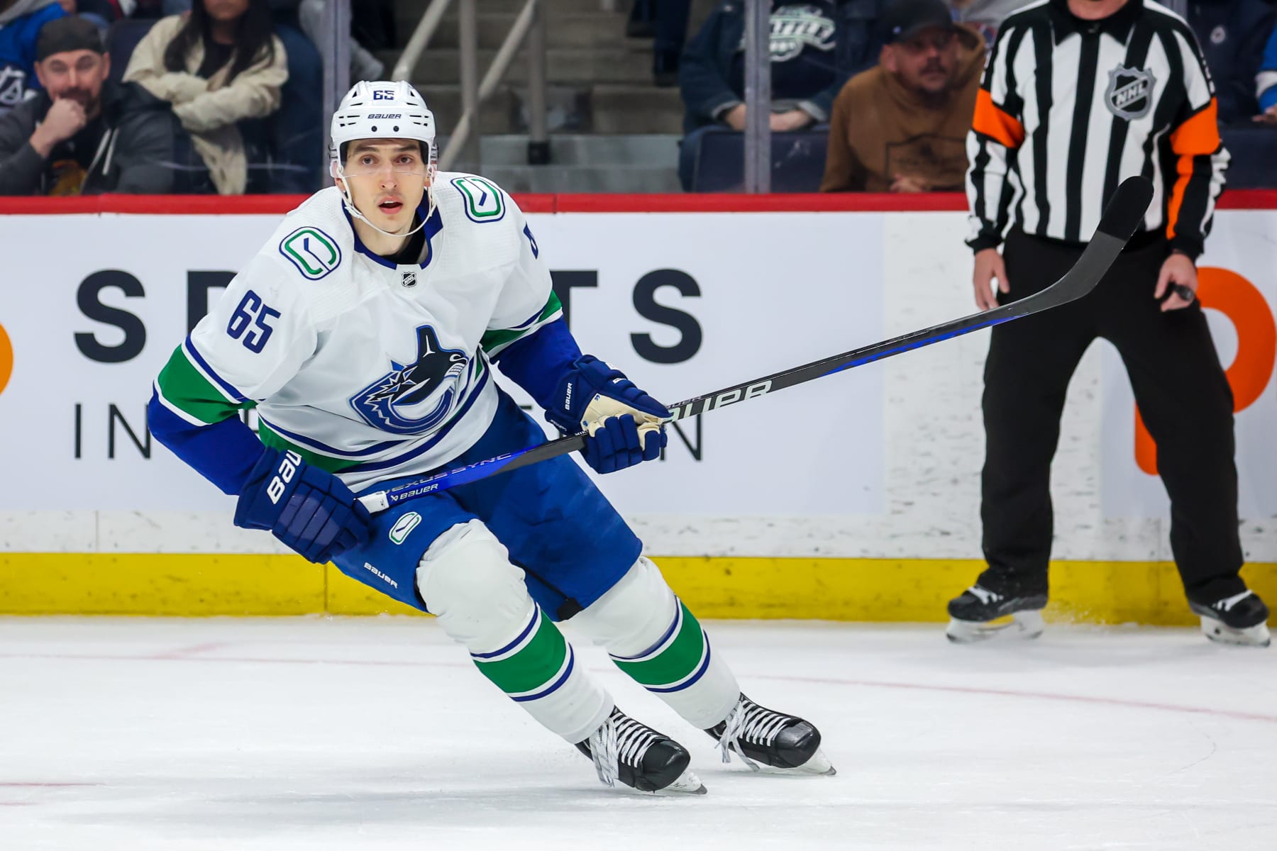 WINNIPEG, CANADA - JANUARY 08: Ilya Mikheyev #65 of the Vancouver Canucks skates during first period action against the Winnipeg Jets at Canada Life Centre on January 08, 2023 in Winnipeg, Manitoba, Canada. (Photo by Jonathan Kozub/NHLI via Getty Images)