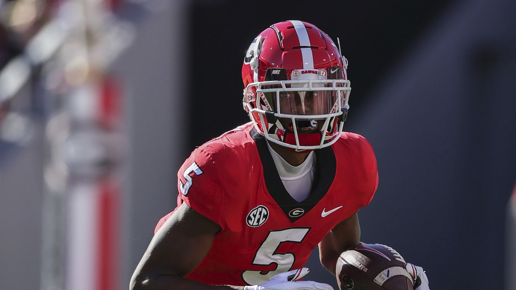 Georgia wide receiver Adonai Mitchell (5) carries the ball against Kentucky during the first half of an NCAA college football game Saturday, Oct. 16, 2021 in Athens, Ga. (AP Photo/Butch Dill)