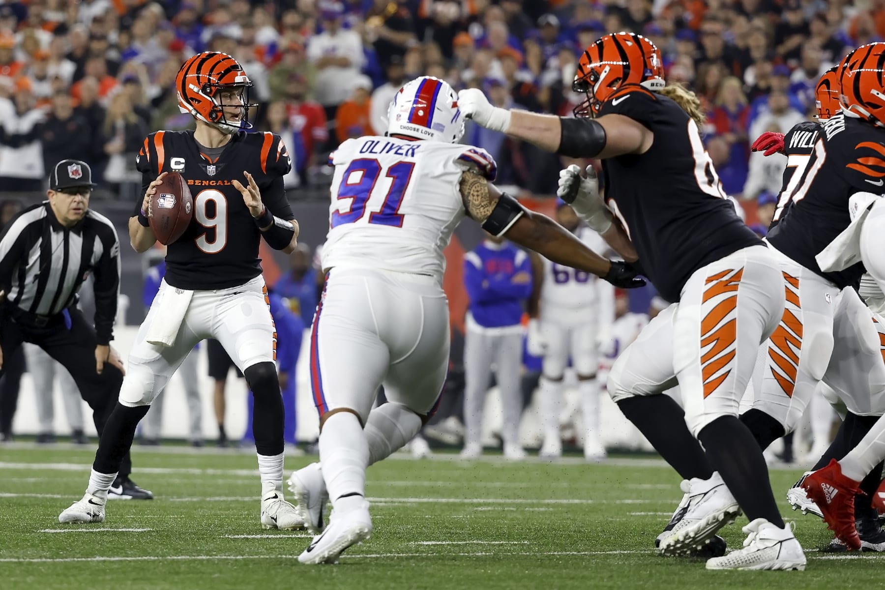 CINCINNATI, OH - JANUARY 02:  Joe Burrow #9 of the Cincinnati Bengals looks to pass the ball during the game against the Buffalo Bills at Paycor Stadium on January 2, 2023 in Cincinnati, Ohio. (Photo by Kirk Irwin/Getty Images)