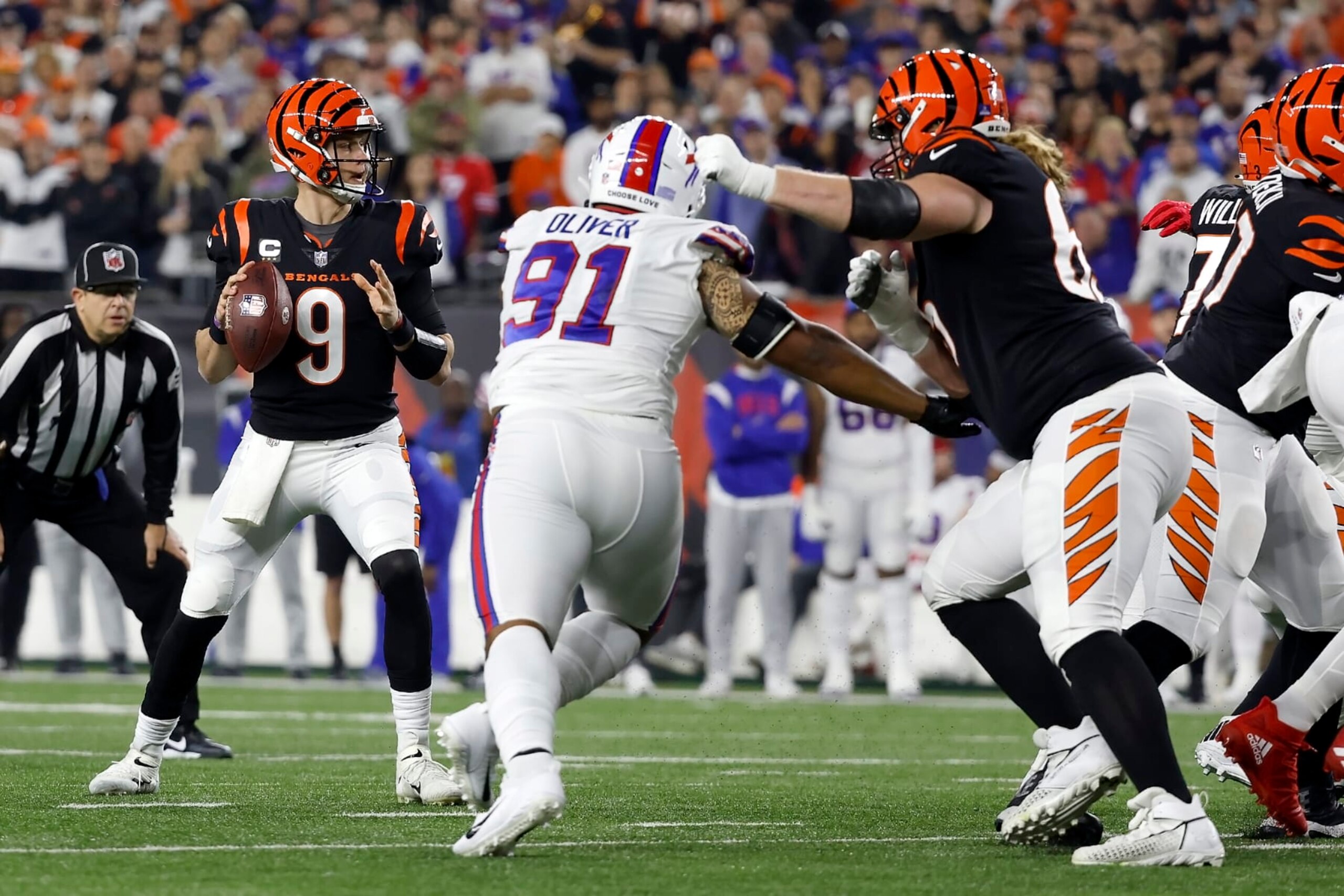 CINCINNATI, OH - JANUARY 02:  Joe Burrow #9 of the Cincinnati Bengals looks to pass the ball during the game against the Buffalo Bills at Paycor Stadium on January 2, 2023 in Cincinnati, Ohio. (Photo by Kirk Irwin/Getty Images)
