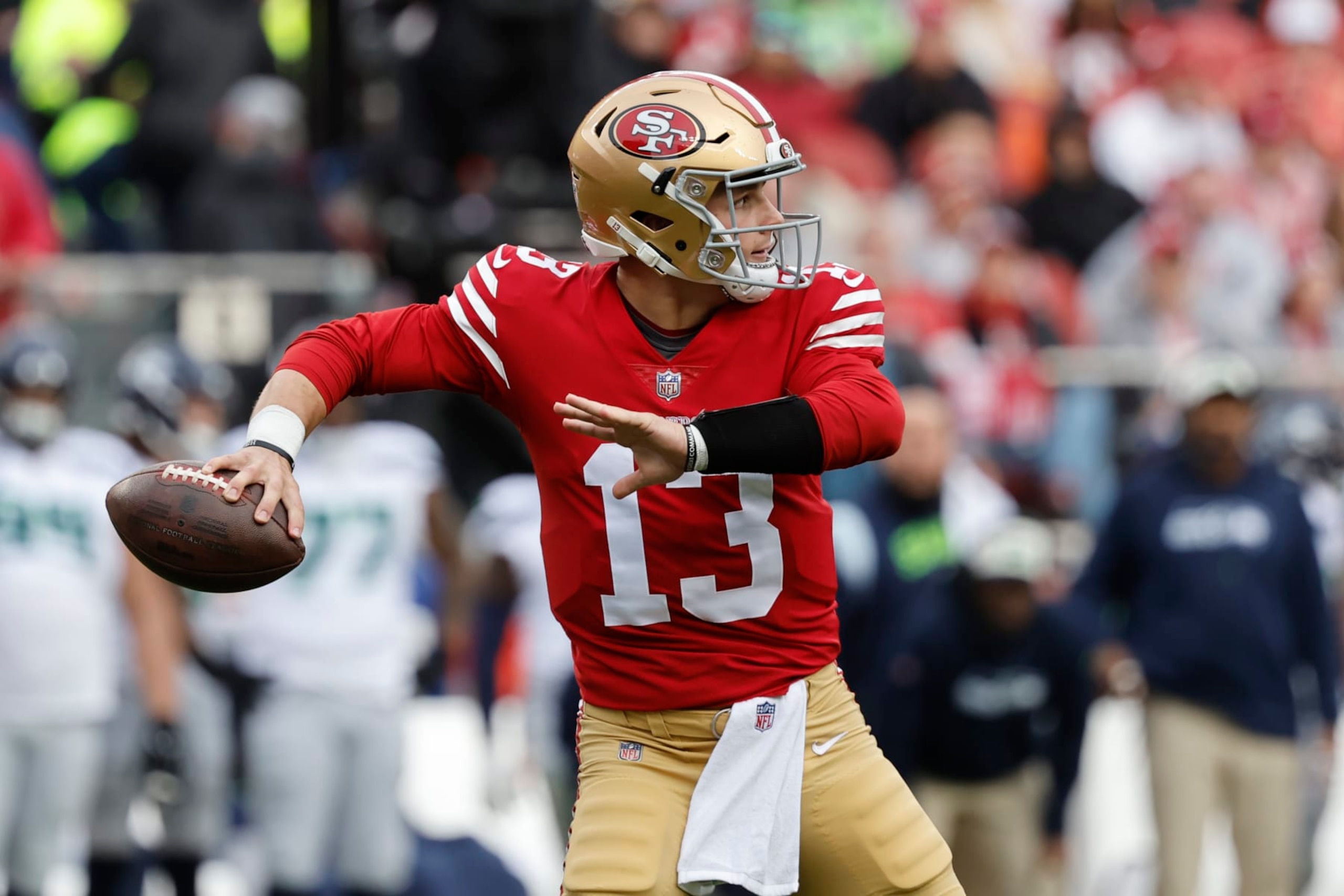 San Francisco 49ers quarterback Brock Purdy (13) passes against the Seattle Seahawks during the first half of an NFL wild card playoff football game in Santa Clara, Calif., Saturday, Jan. 14, 2023. (AP Photo/Josie Lepe)