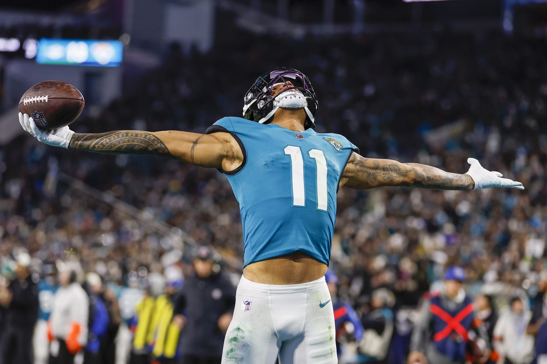 JACKSONVILLE, FL - JANUARY 14: Jacksonville Jaguars wide receiver Marvin Jones Jr. (11) reacts after scoring a touchdown during the game between the Los Angeles Chargers and the Jacksonville Jaguars on January 14, 2023 at TIAA Bank Field in Jacksonville, Fl. (Photo by David Rosenblum/Icon Sportswire via Getty Images)