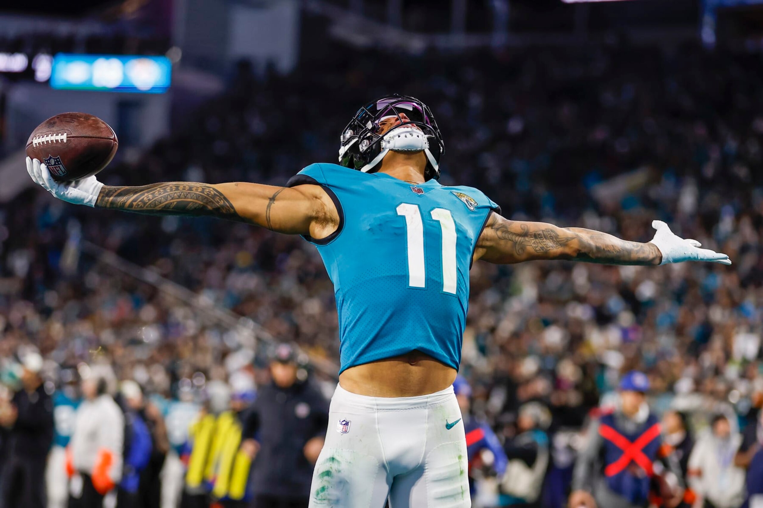 JACKSONVILLE, FL - JANUARY 14: Jacksonville Jaguars wide receiver Marvin Jones Jr. (11) reacts after scoring a touchdown during the game between the Los Angeles Chargers and the Jacksonville Jaguars on January 14, 2023 at TIAA Bank Field in Jacksonville, Fl. (Photo by David Rosenblum/Icon Sportswire via Getty Images)
