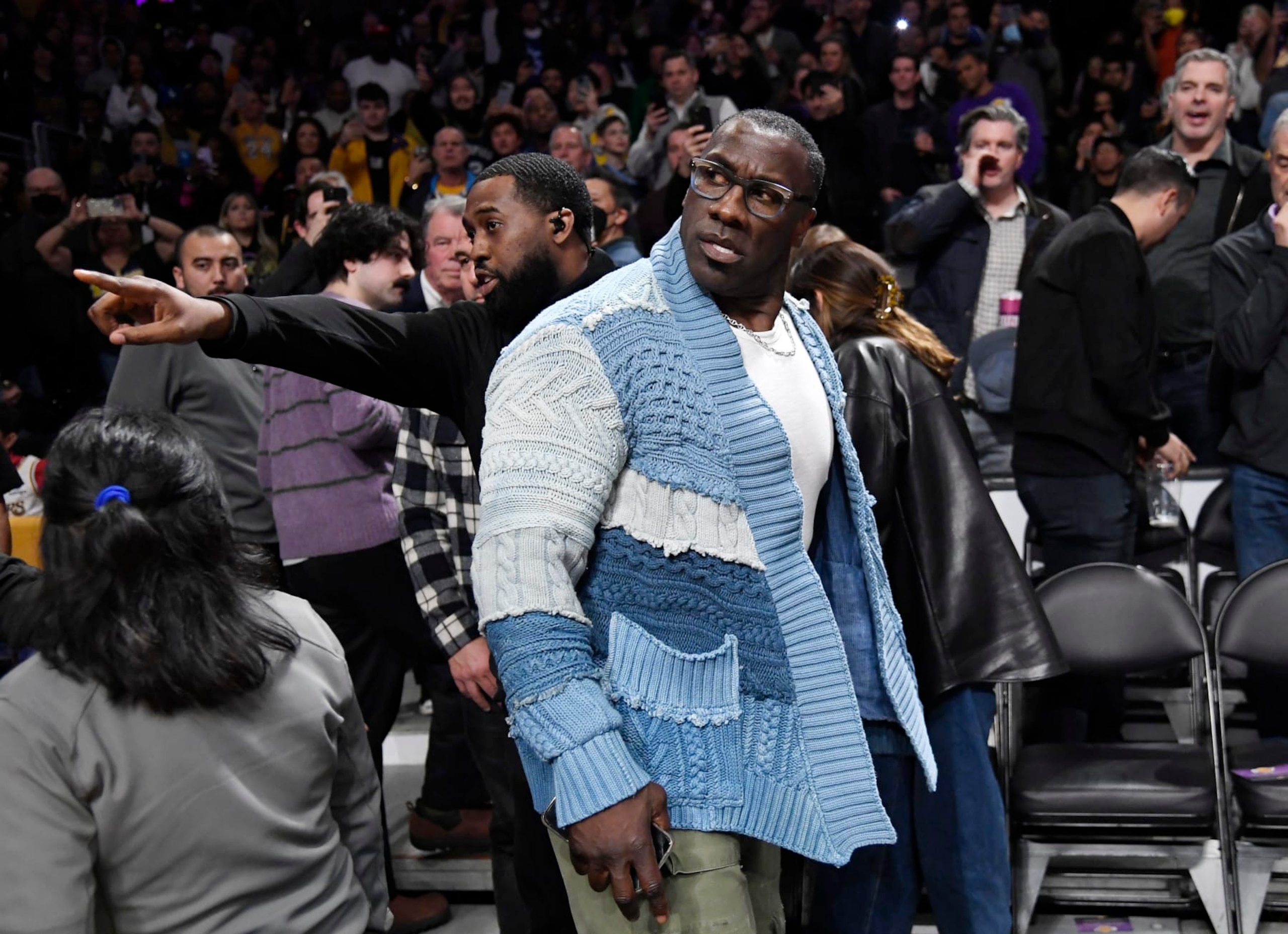 LOS ANGELES, CA - JANUARY 20: Shannon Sharpe is restrained by security after verbal altercation with Tee Morant, father of Ja Morant #12 of the Memphis Grizzlies, during the halftime against the Los Angeles Lakers at Crypto.com Arena on January 20, 2023 in Los Angeles, California. NOTE TO USER: User expressly acknowledges and agrees that, by downloading and or using this photograph, User is consenting to the terms and conditions of the Getty Images License Agreement. (Photo by Kevork Djansezian/Getty Images)