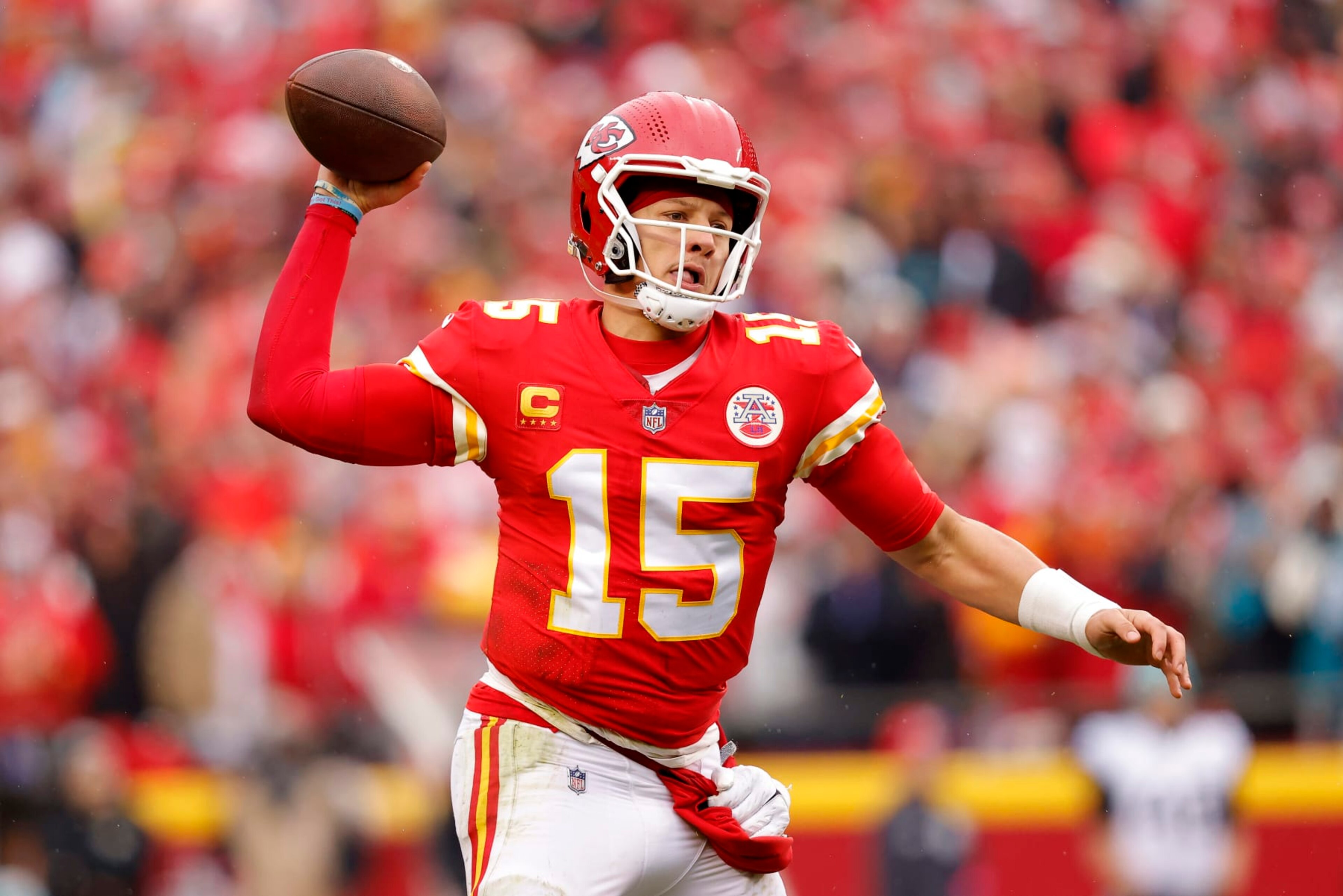 KANSAS CITY, MISSOURI - JANUARY 21: Patrick Mahomes #15 of the Kansas City Chiefs throws a pass against the Jacksonville Jaguars during the first quarter in the AFC Divisional Playoff game at Arrowhead Stadium on January 21, 2023 in Kansas City, Missouri. (Photo by David Eulitt/Getty Images)