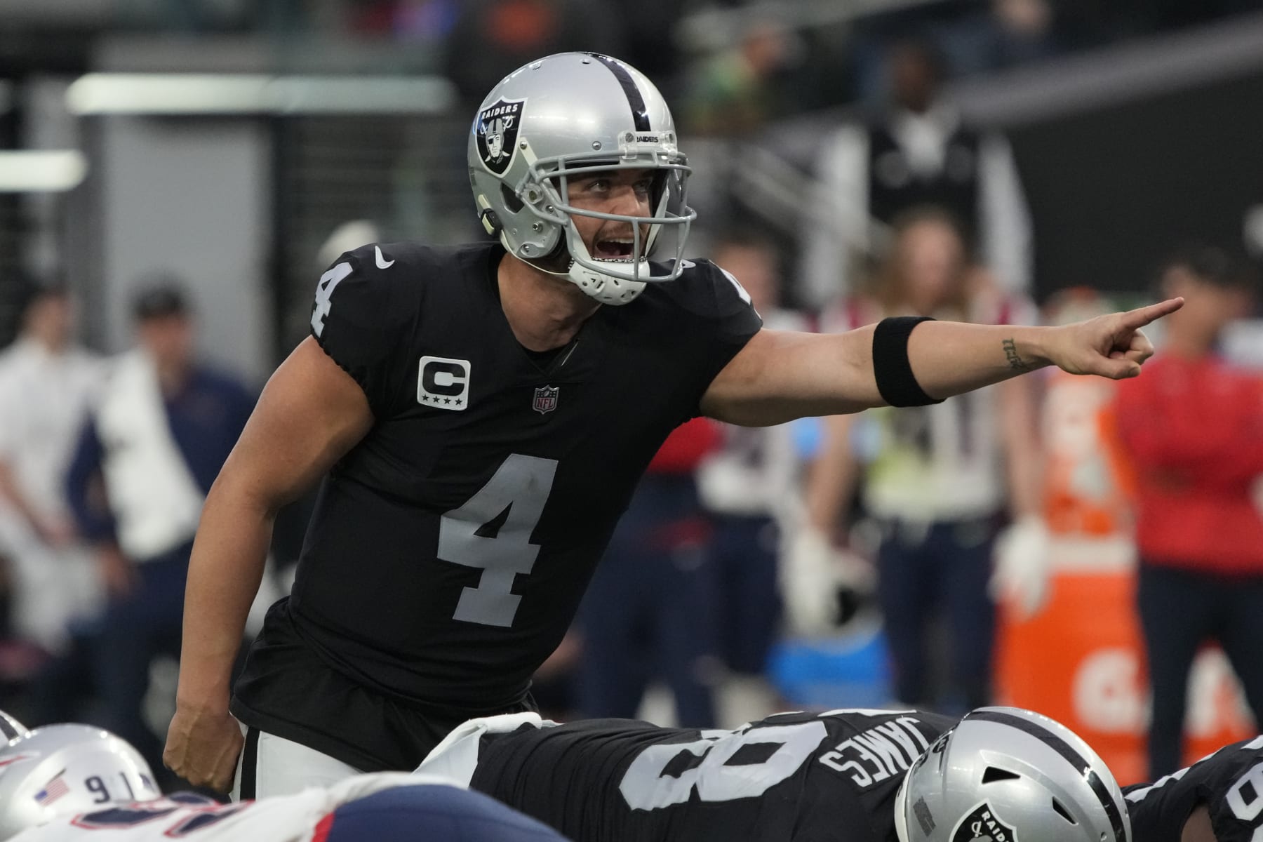 Las Vegas Raiders quarterback Derek Carr (4) lines up against the New England Patriots during the first half of an NFL football game, Sunday, Dec. 18, 2022, in Las Vegas. (AP Photo/Rick Scuteri)